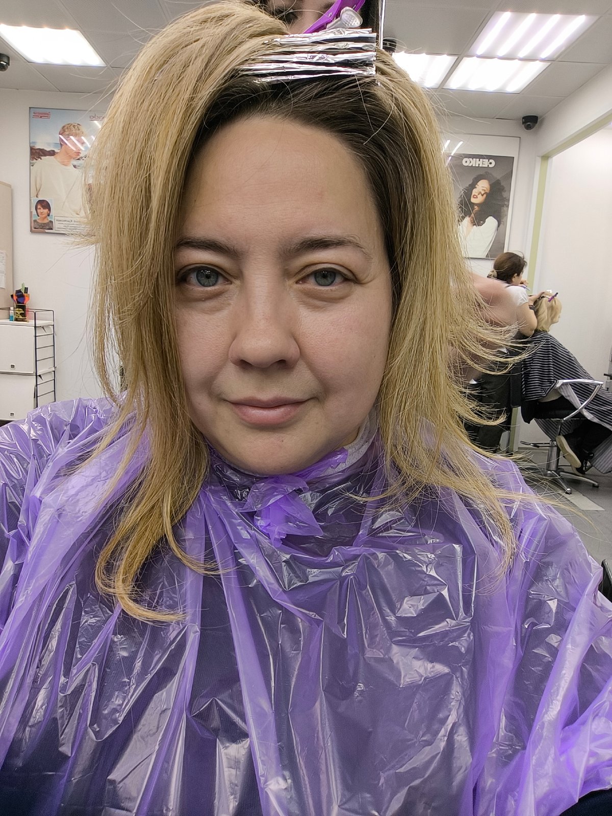 Woman takes selfie during hair salon visit in Khimki