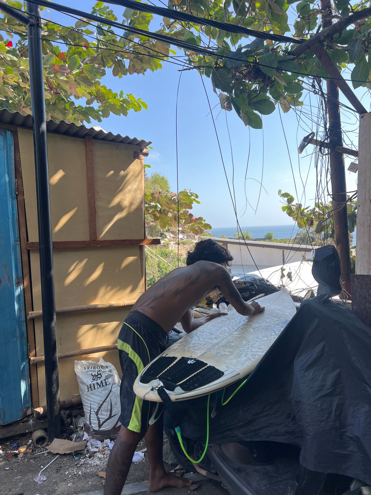 Surf, monkeys, and cliffside construction in Kuta Selatan