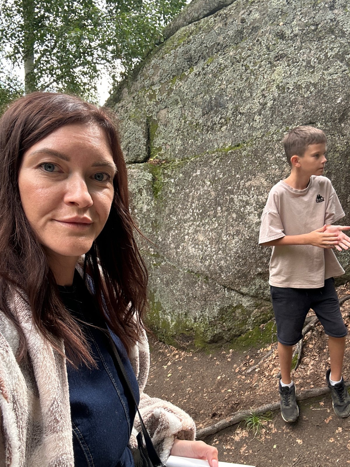 Visiting a cross-topped rock formation in Belokurikha, Russia