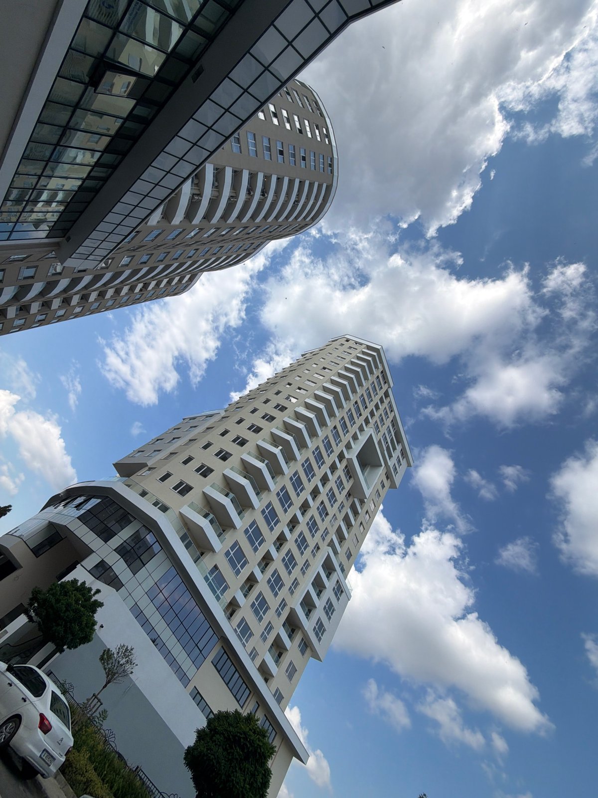 Modern Burgas high-rises and street-level scenes on a sunny morning