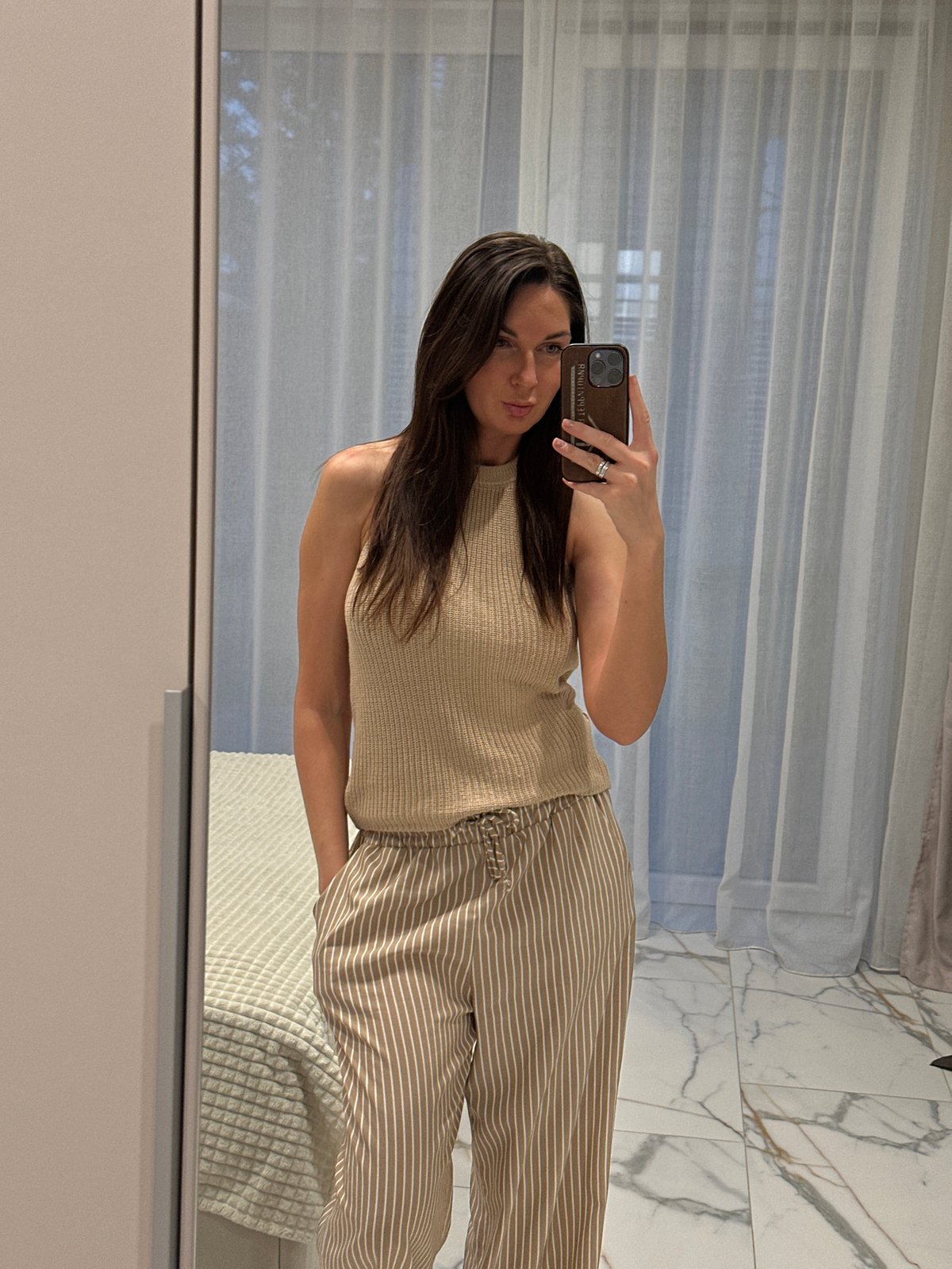 Woman takes indoor selfies in Chaikovsky, Russia
