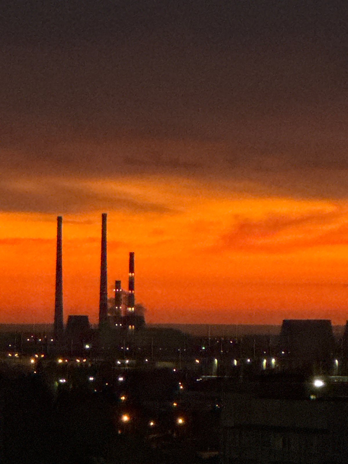 Dramatic sunset illuminates urban landscape across multiple witness perspectives