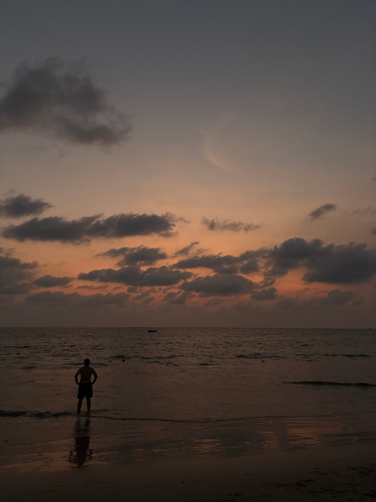 Solitary Figure Captured in Twilight Waters at Thai Beach