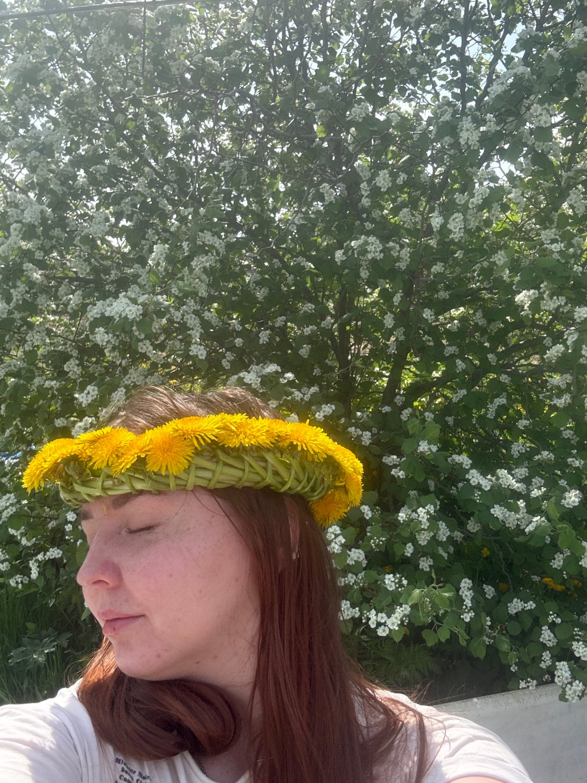 Spring morning portrait session amid dandelion field in rural Russia
