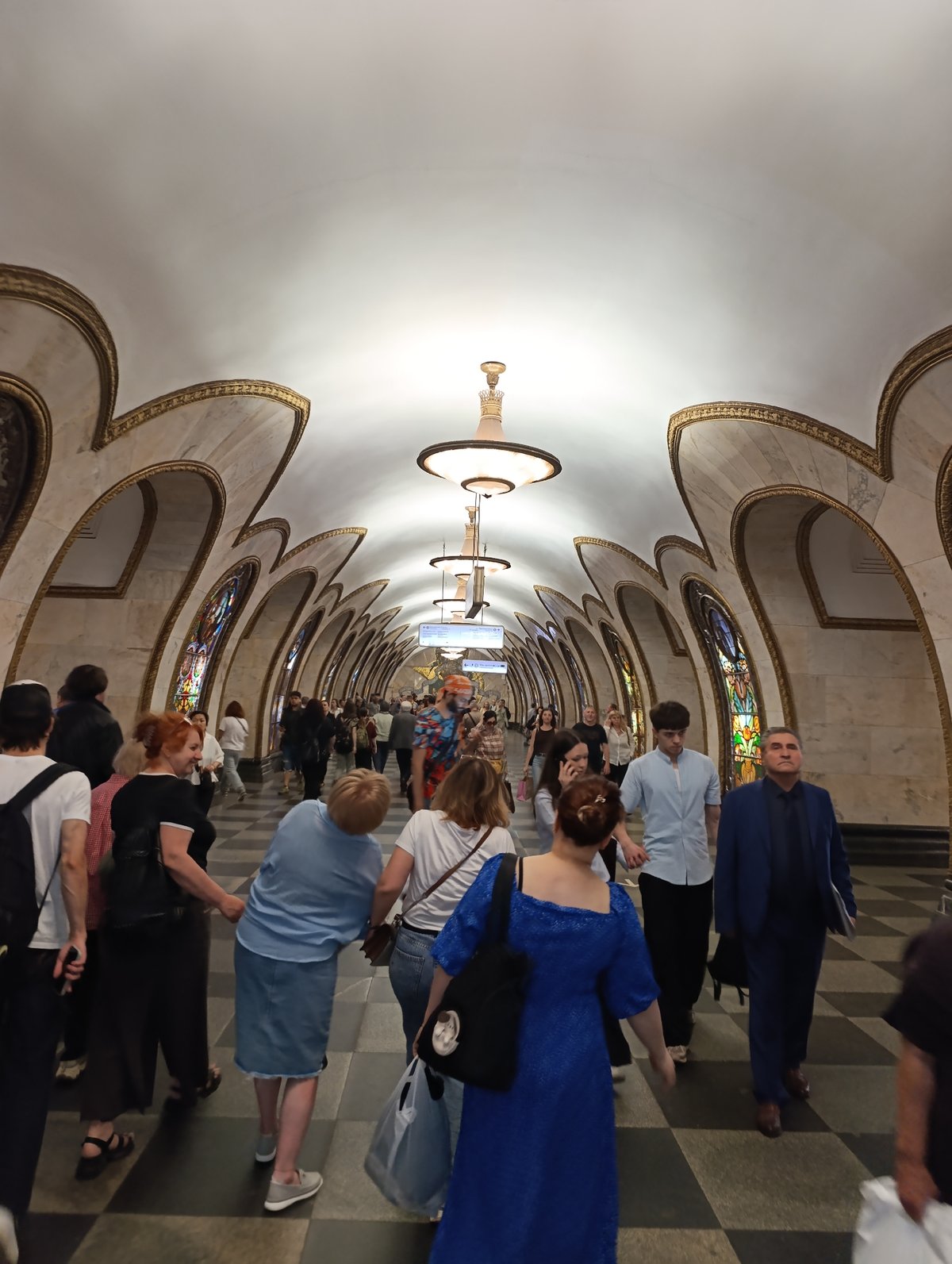 Moscow residents navigate metro stations and city streets during midday