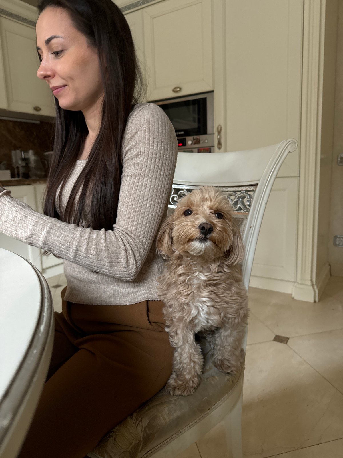 Woman enjoys quiet morning with dog in Krasnoyarsk