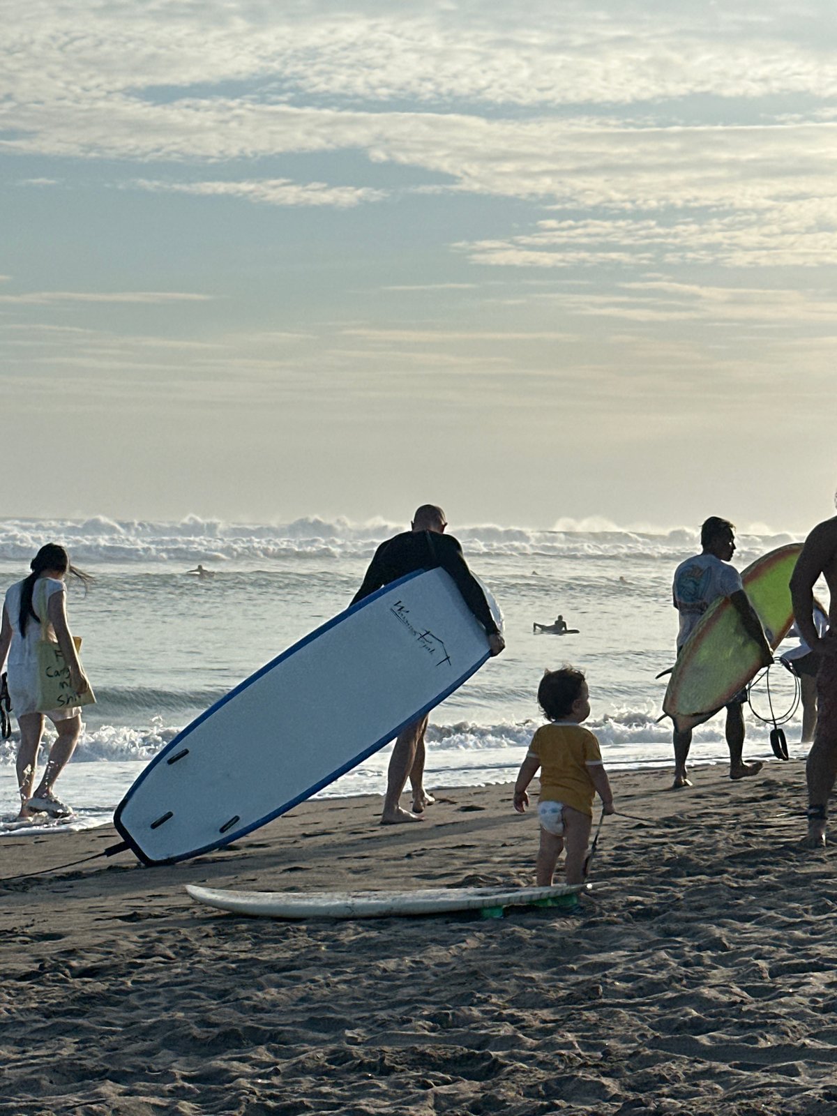 Morning beach life unfolds in North Kuta, Indonesia