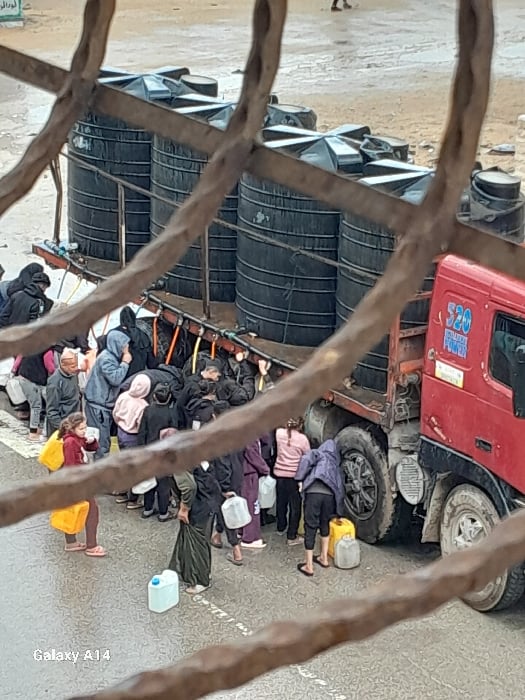 Water distribution documented at Khan Yunis displacement camp