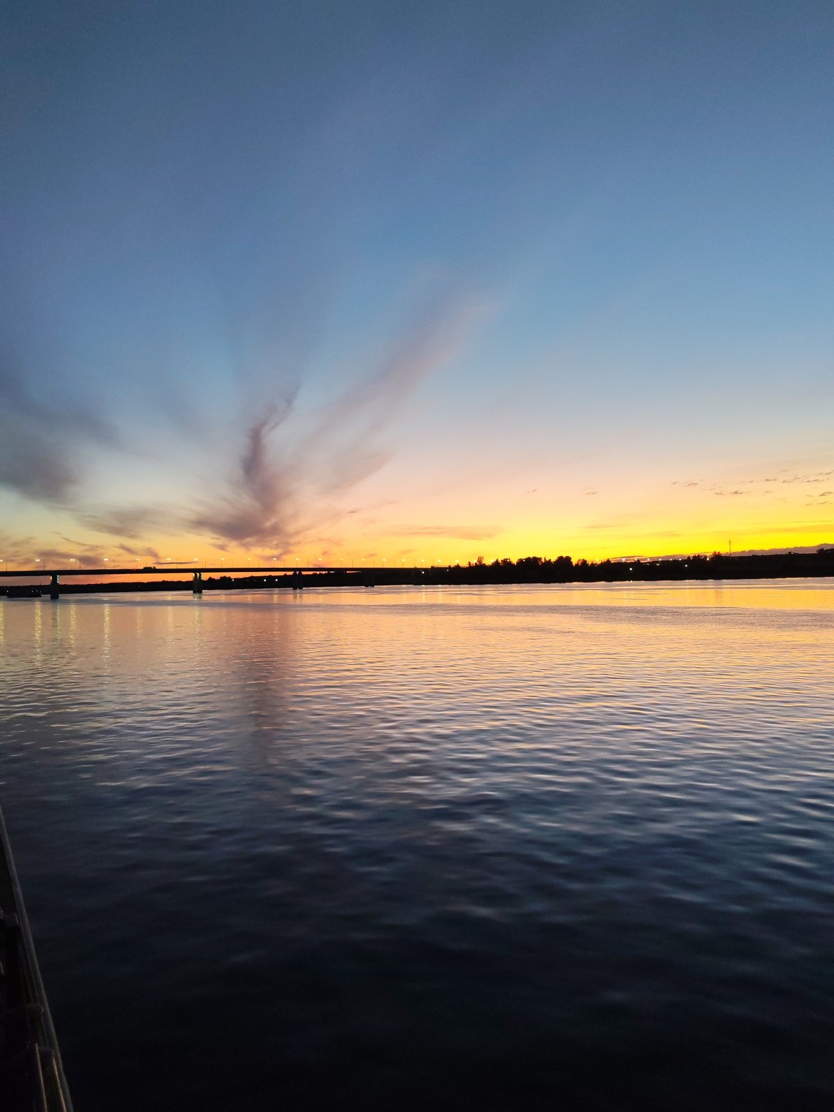 Golden sunset over the Volga, viewed from a river vessel