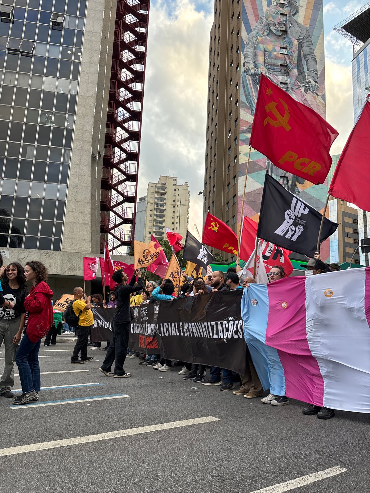 Protesters march through São Paulo streets under police watch