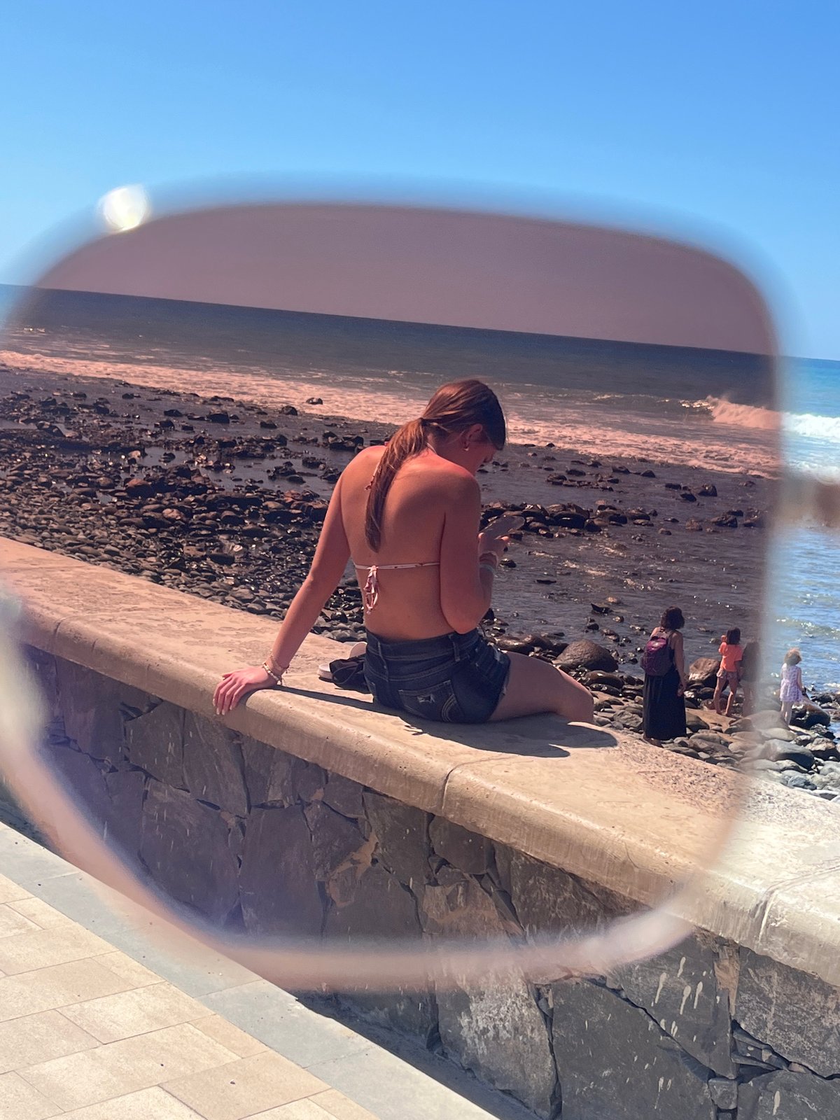 Tourists observe coastline from viewpoints in Maspalomas, Spain