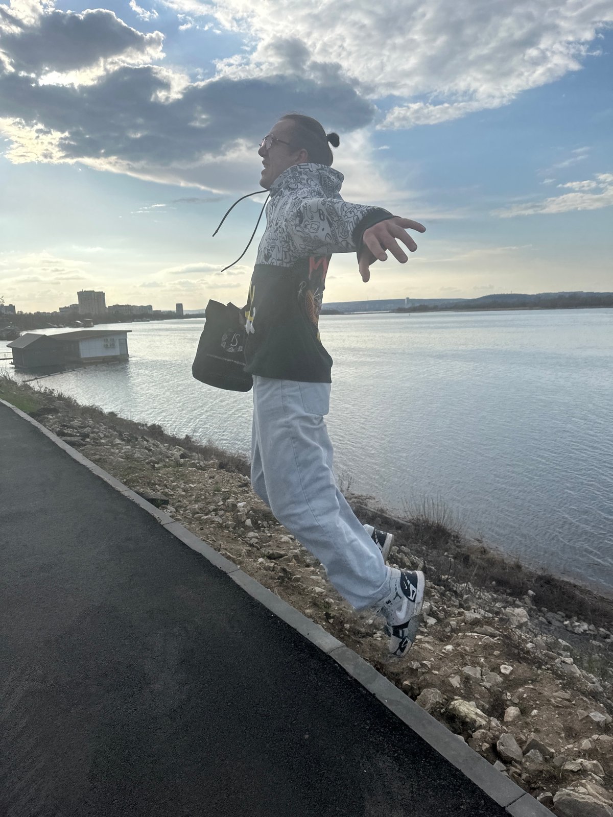 Casual riverside gathering observed along Volga River in Engels