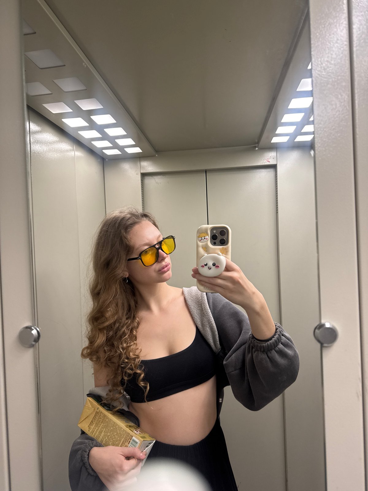 Young woman documents morning routine with selfies in Izhevsk