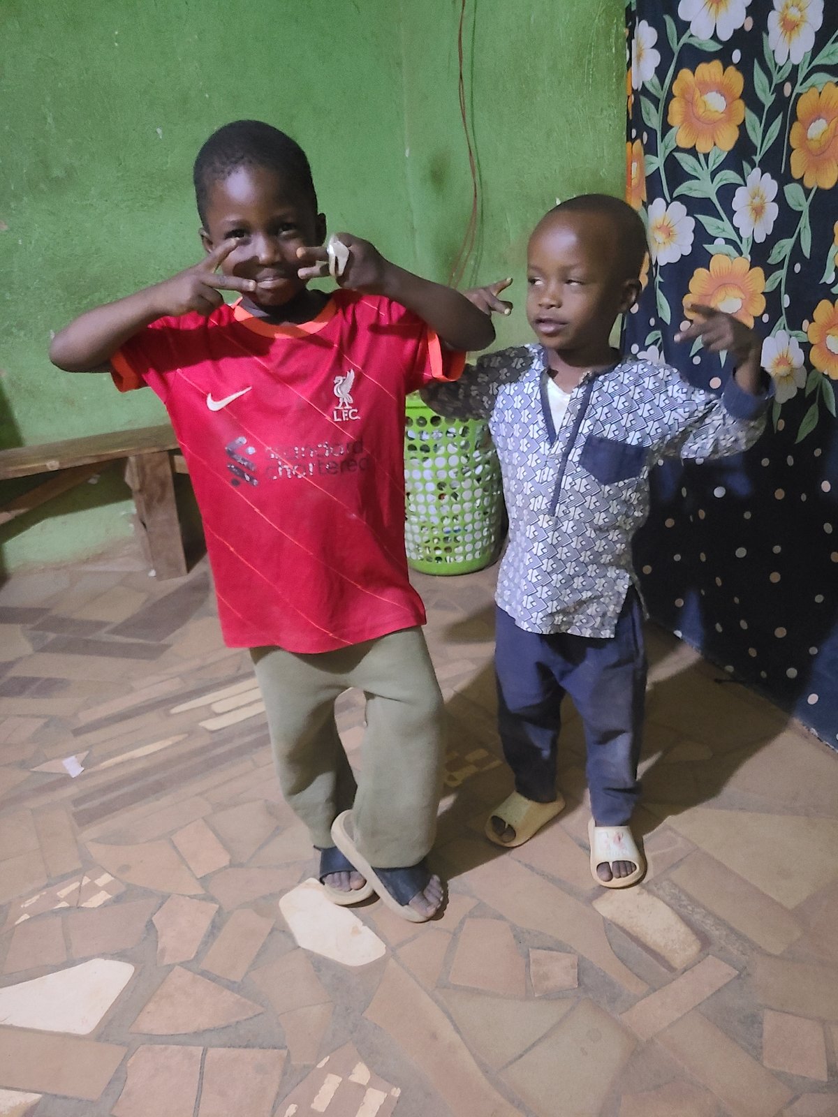 Children playing and posing in family home setting