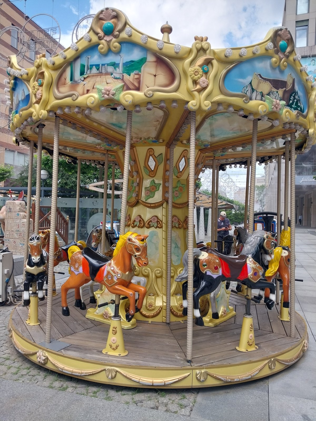 Dnipro plaza buzzes with fountains, carousels, and street life