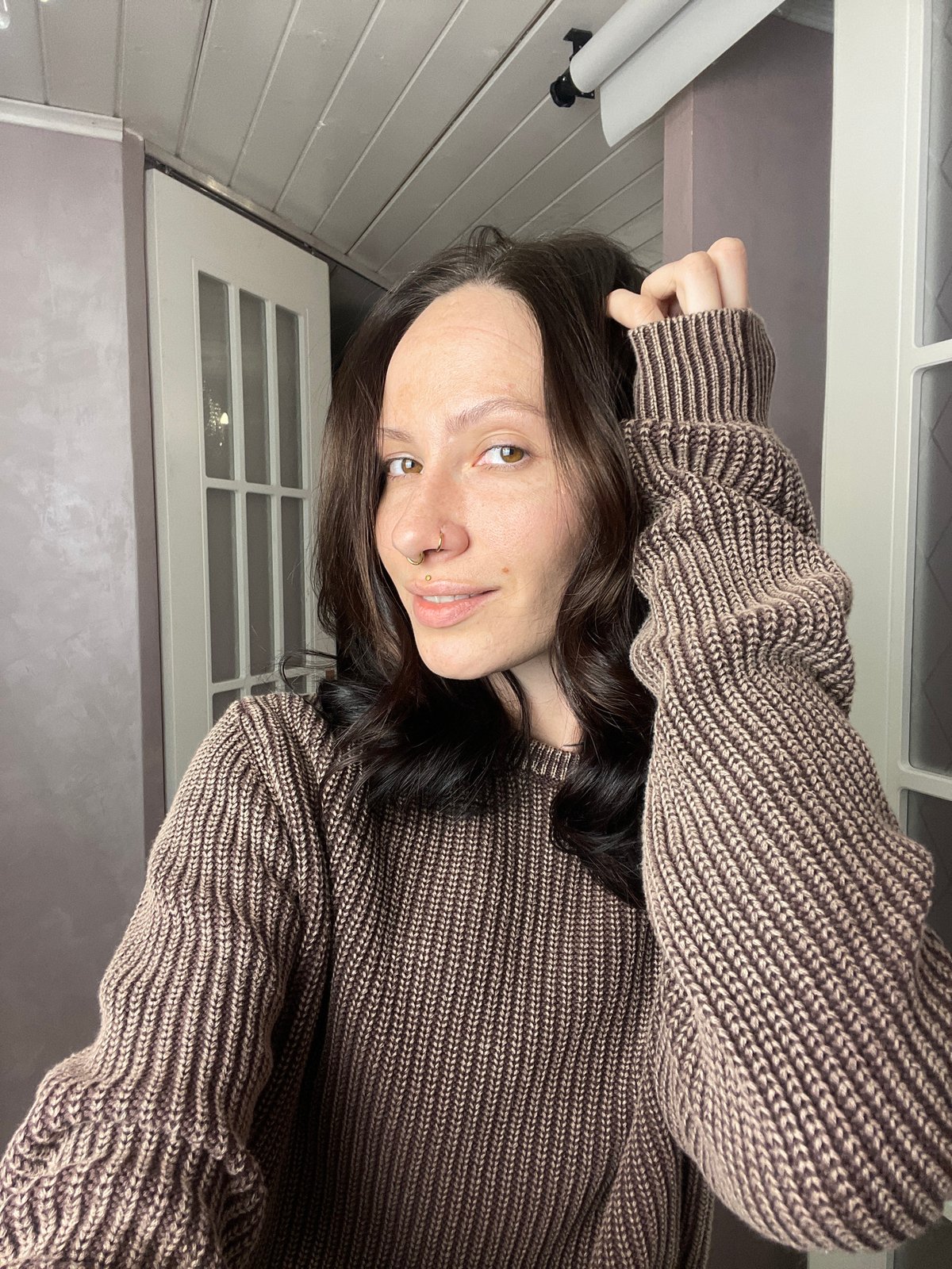 Woman poses for indoor portrait in Izhevsk