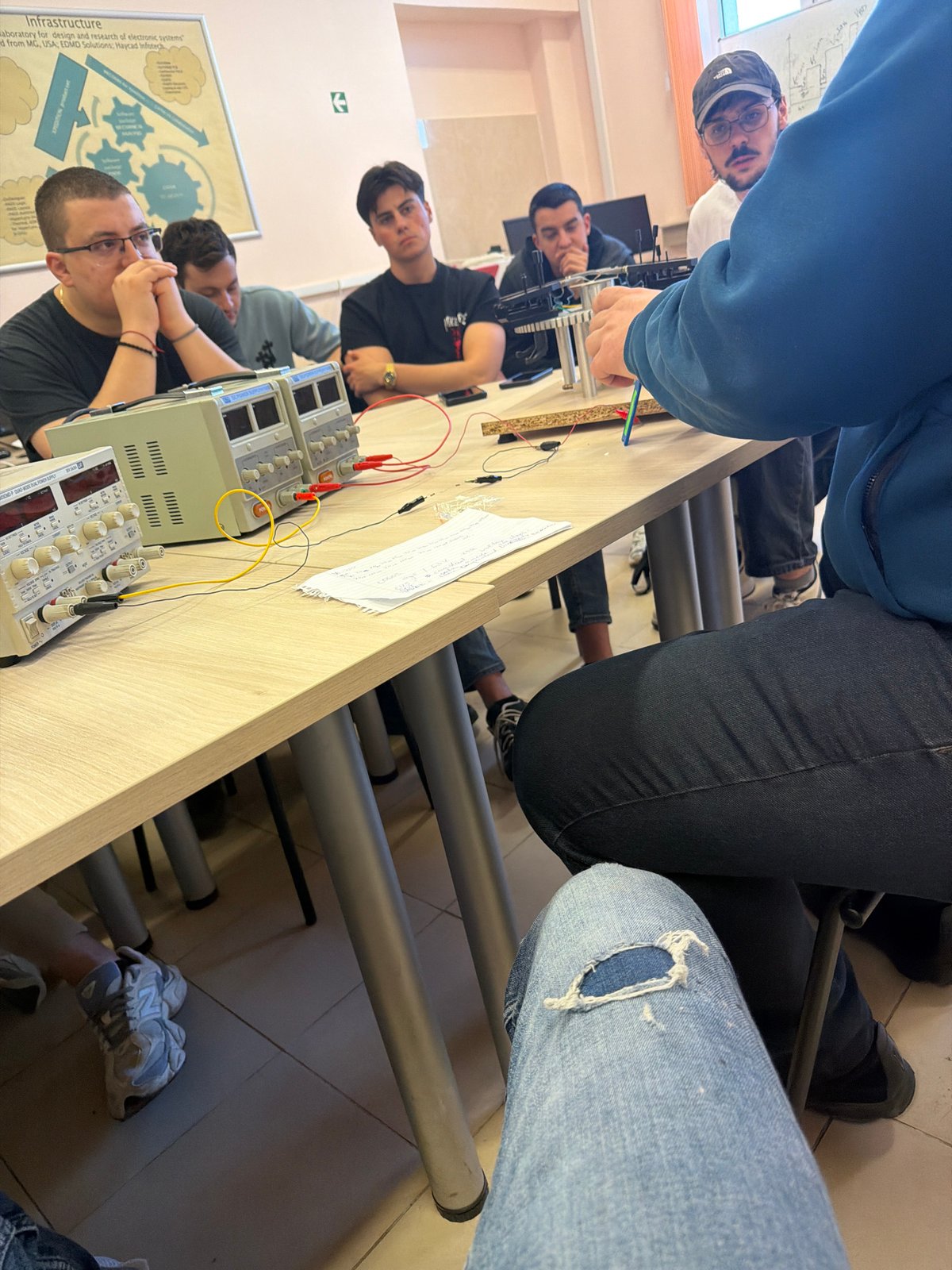 Students conduct electronics experiment in classroom laboratory
