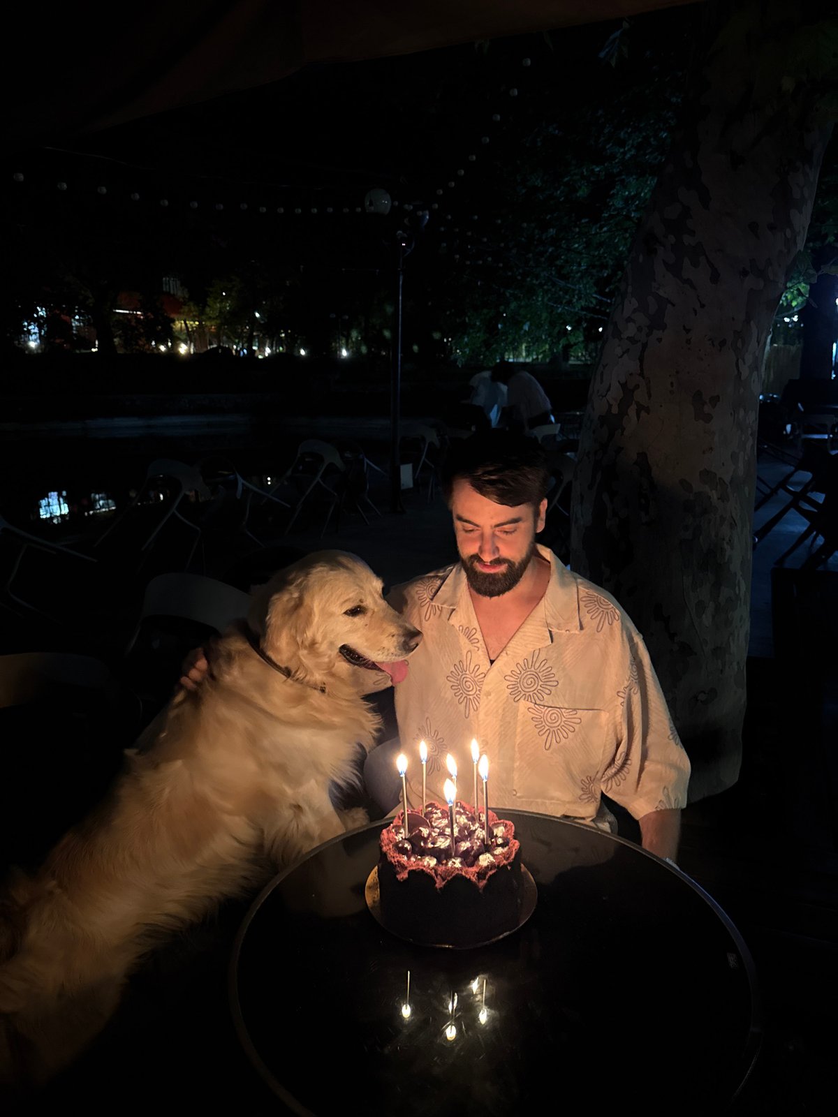 Man and golden retriever spotted at Yerevan garden cafe