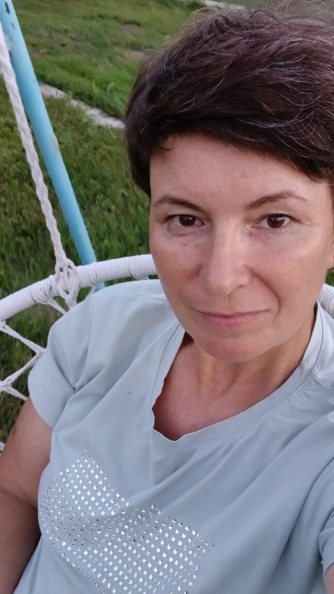 Lazy summer afternoon at home with cats, dogs, and a swing