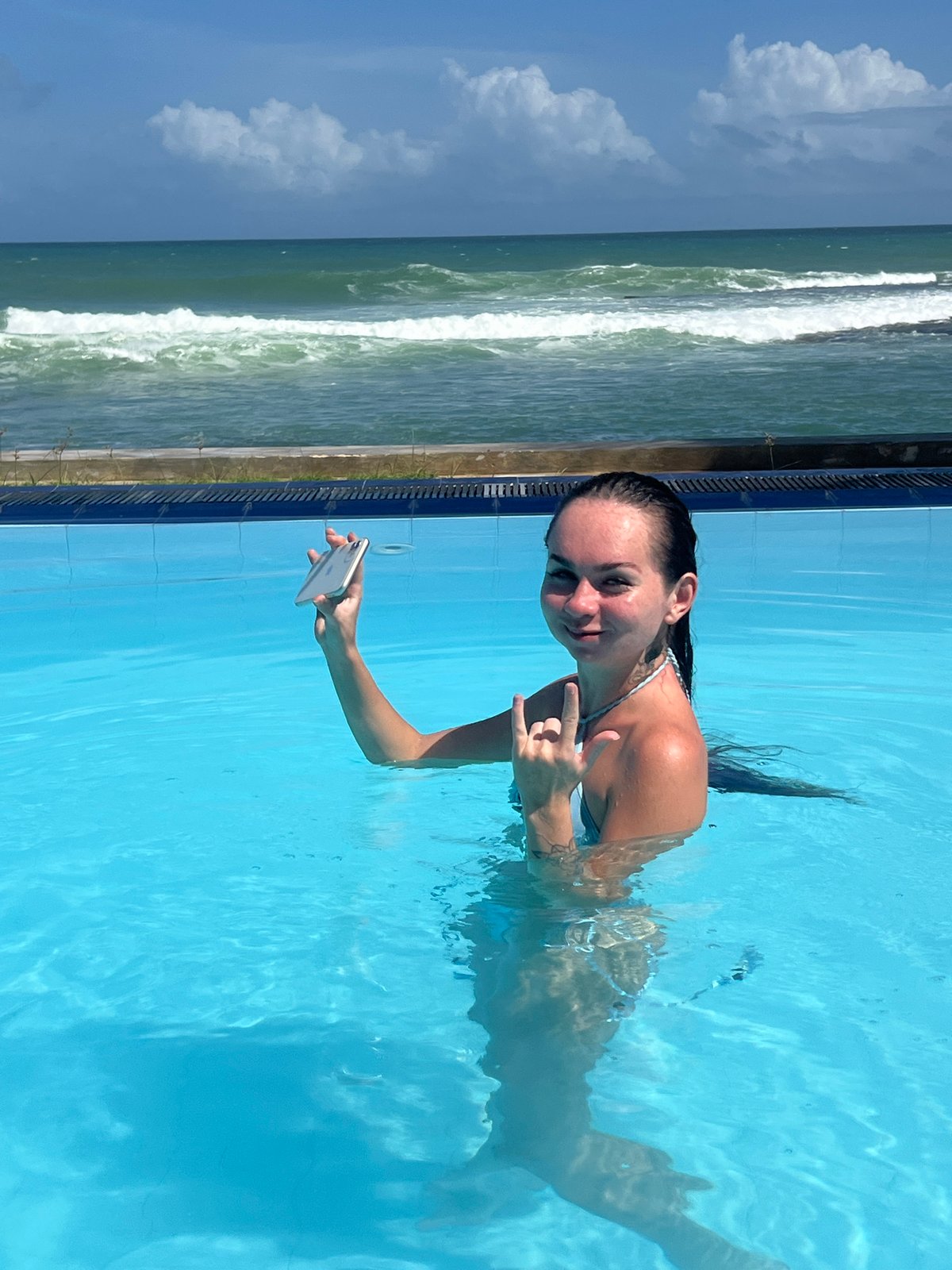 Woman poses for selfies in pool near Sri Lankan coast