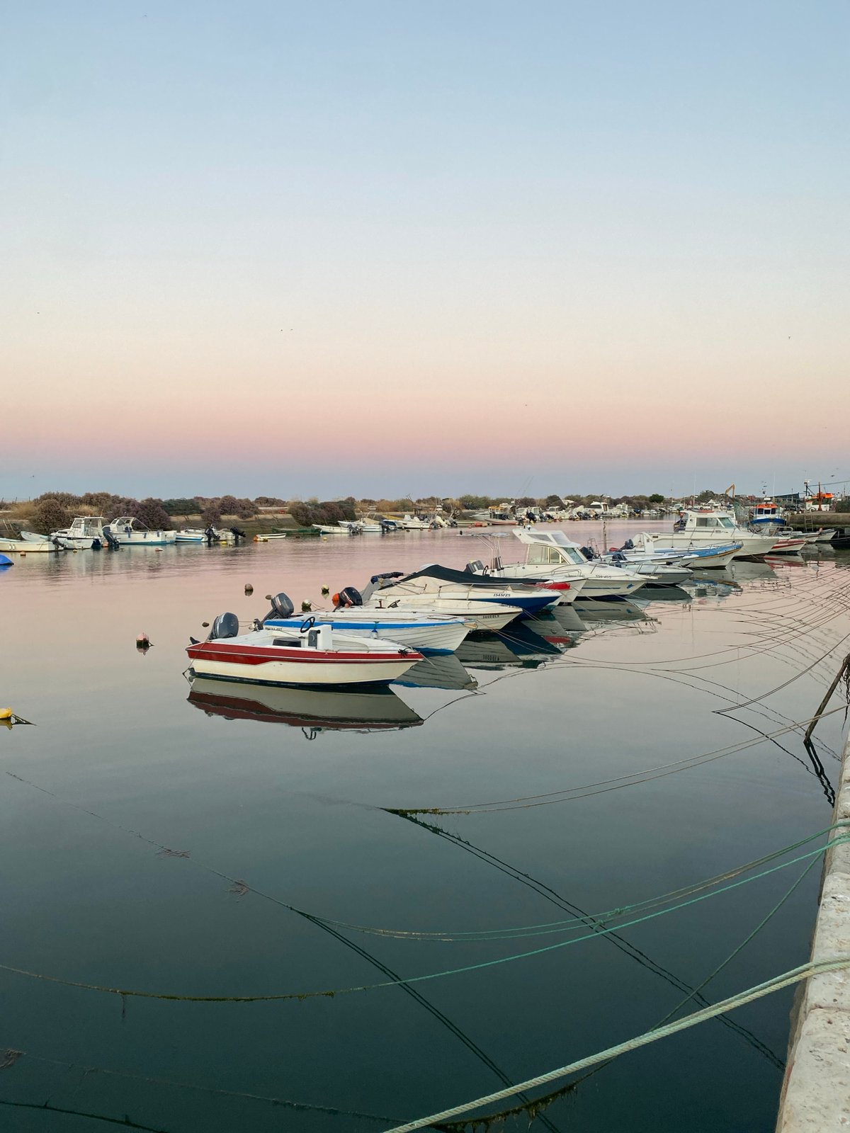 Evening harbor scenes captured during sunset in Olhão, Portugal