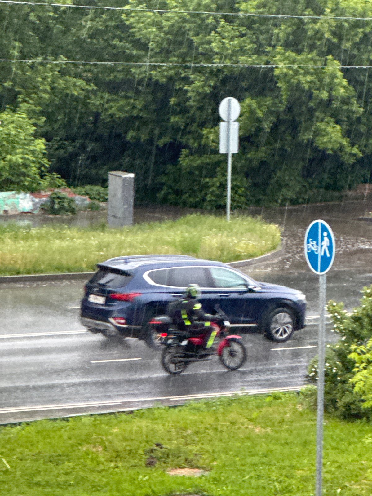 Rainy afternoon documented in Perm, Russia with traffic scenes