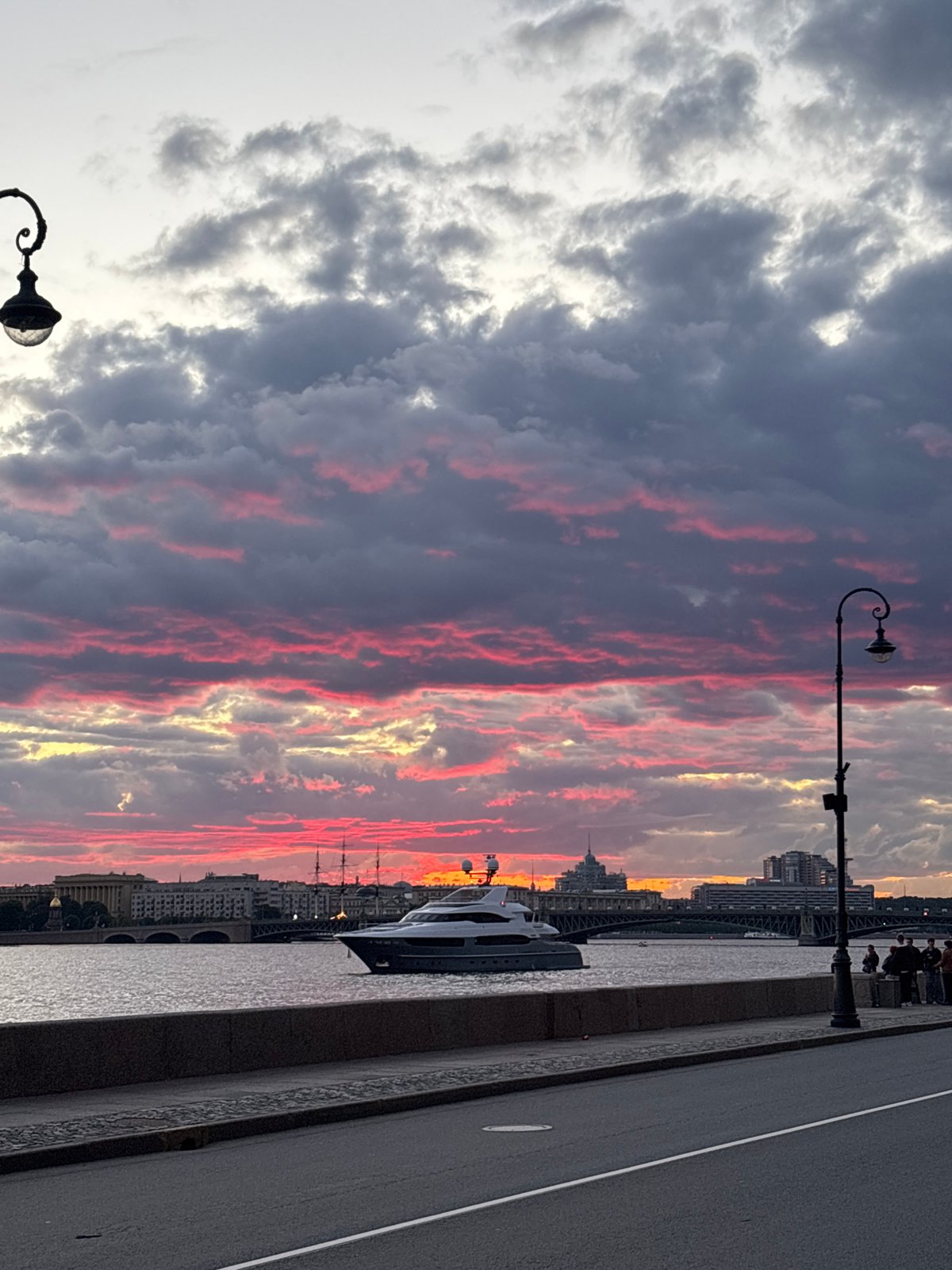 Saint Petersburg's Neva River glows through a dramatic summer sunset