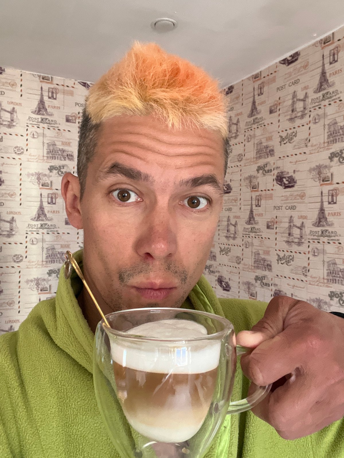 Man in bathrobe holds coffee pitcher in Chaikovsky home