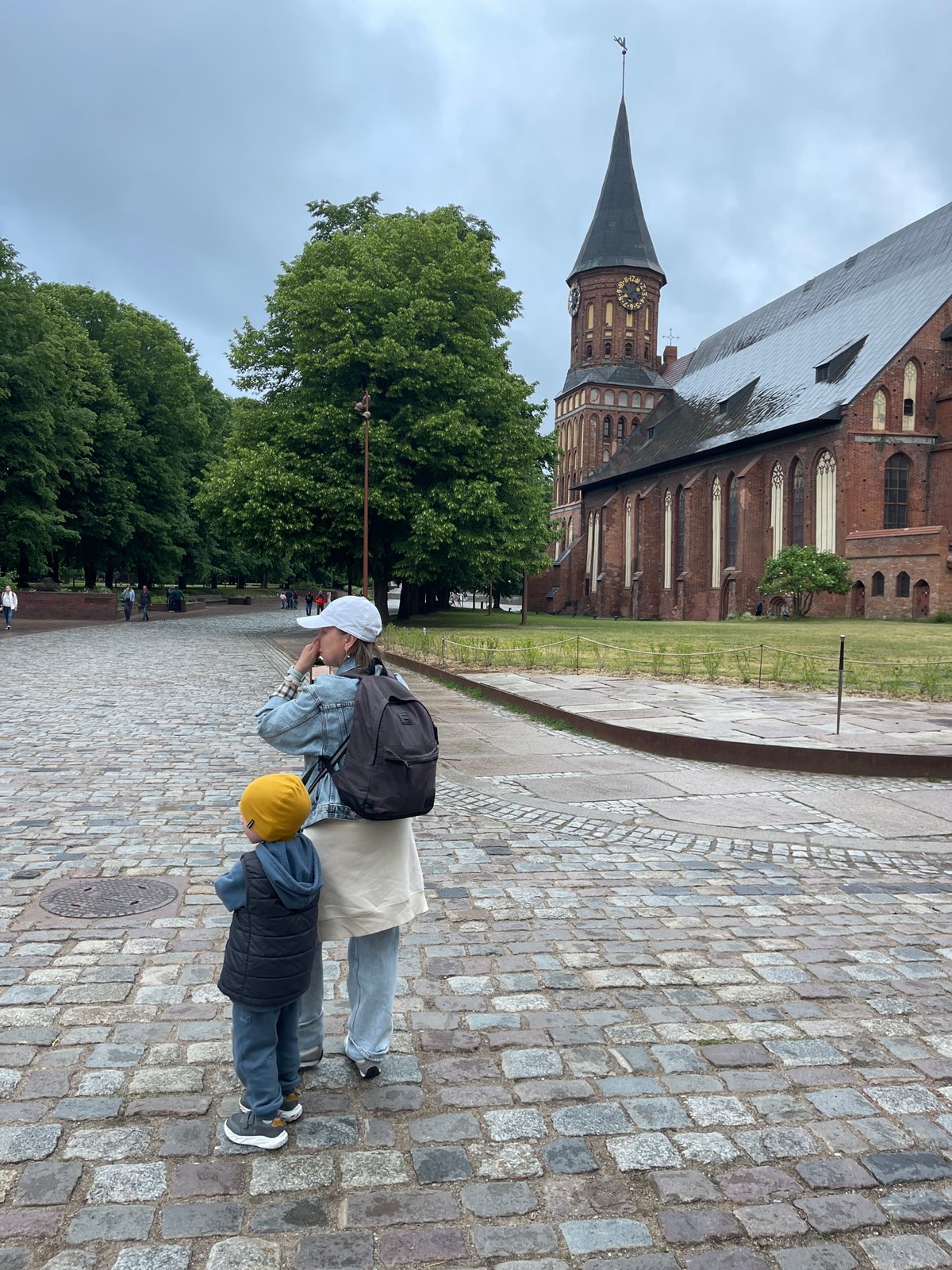 Tourist documents historic Kaliningrad walking tour around cathedral district
