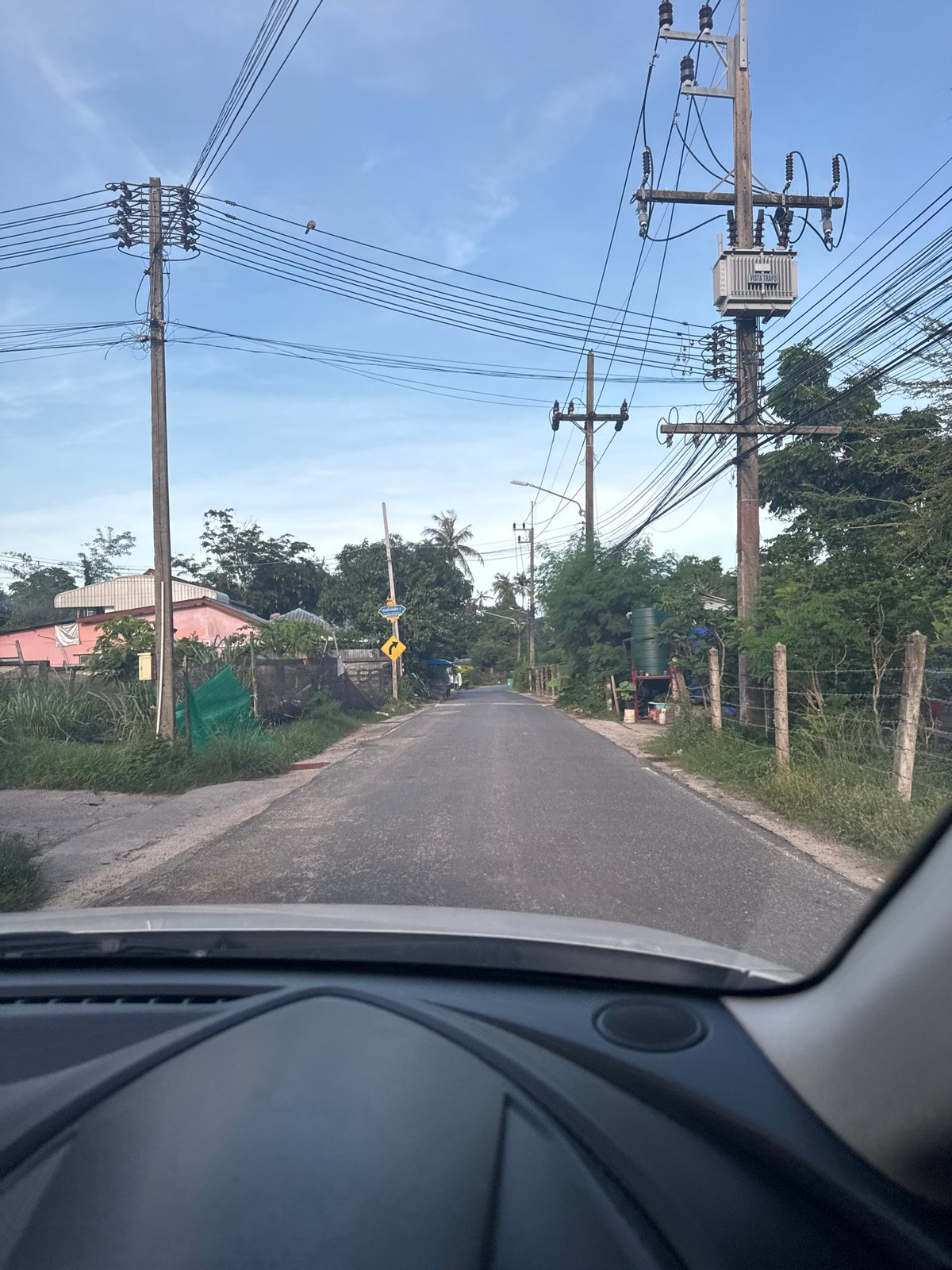Vehicle journey documented through roadside scenes in Rawai, Thailand