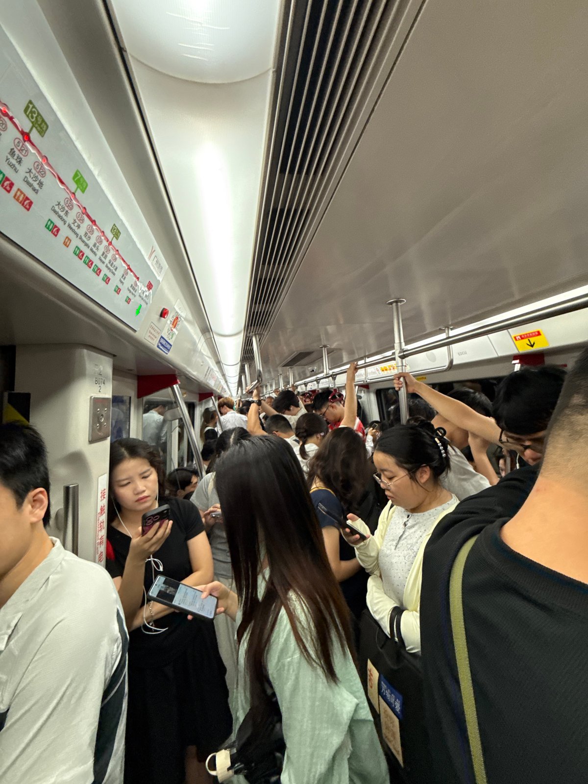 Crowded subway car documented in Tianhe District during peak hours