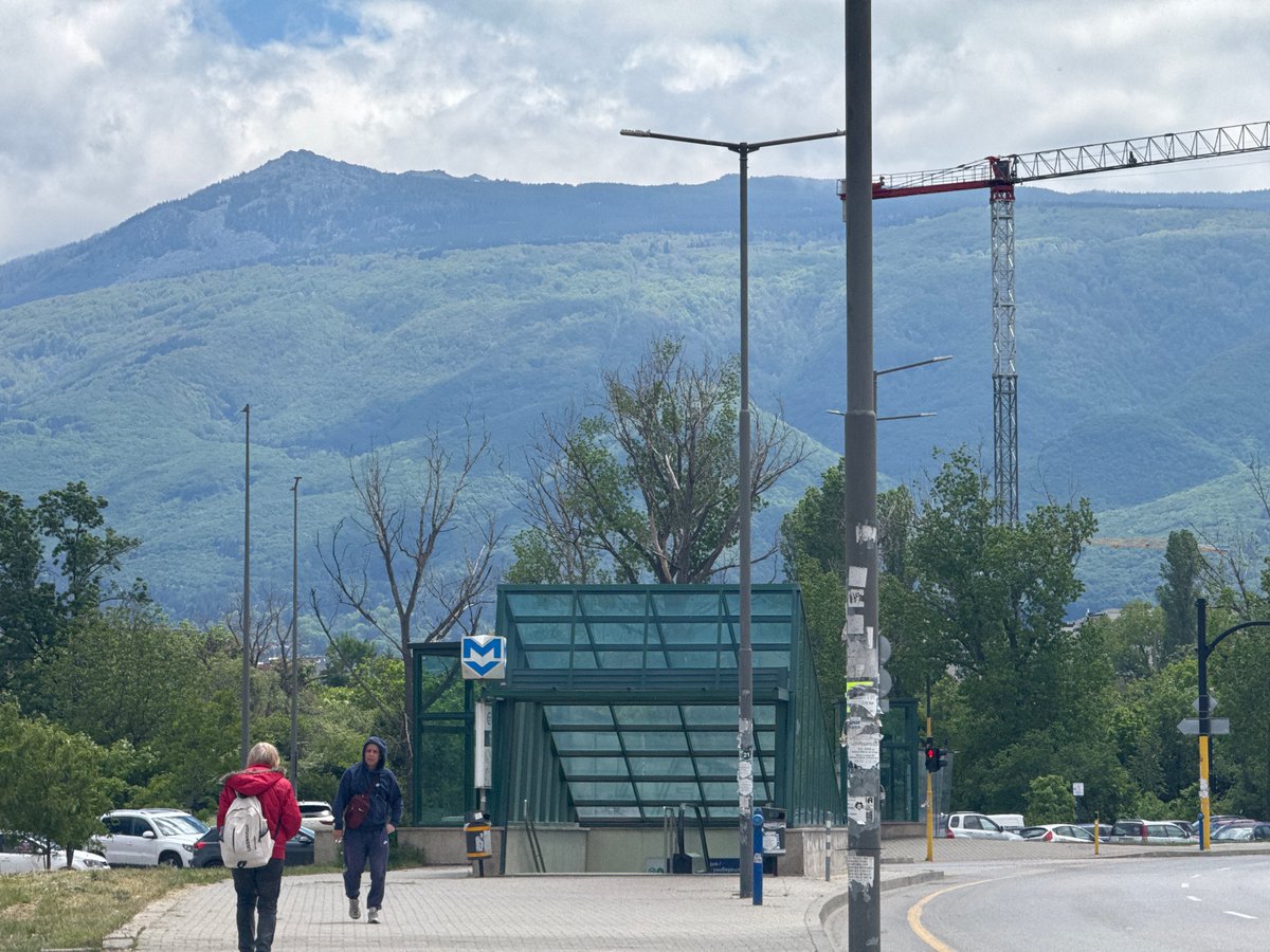 Pedestrians walk past Sofia metro station entrance