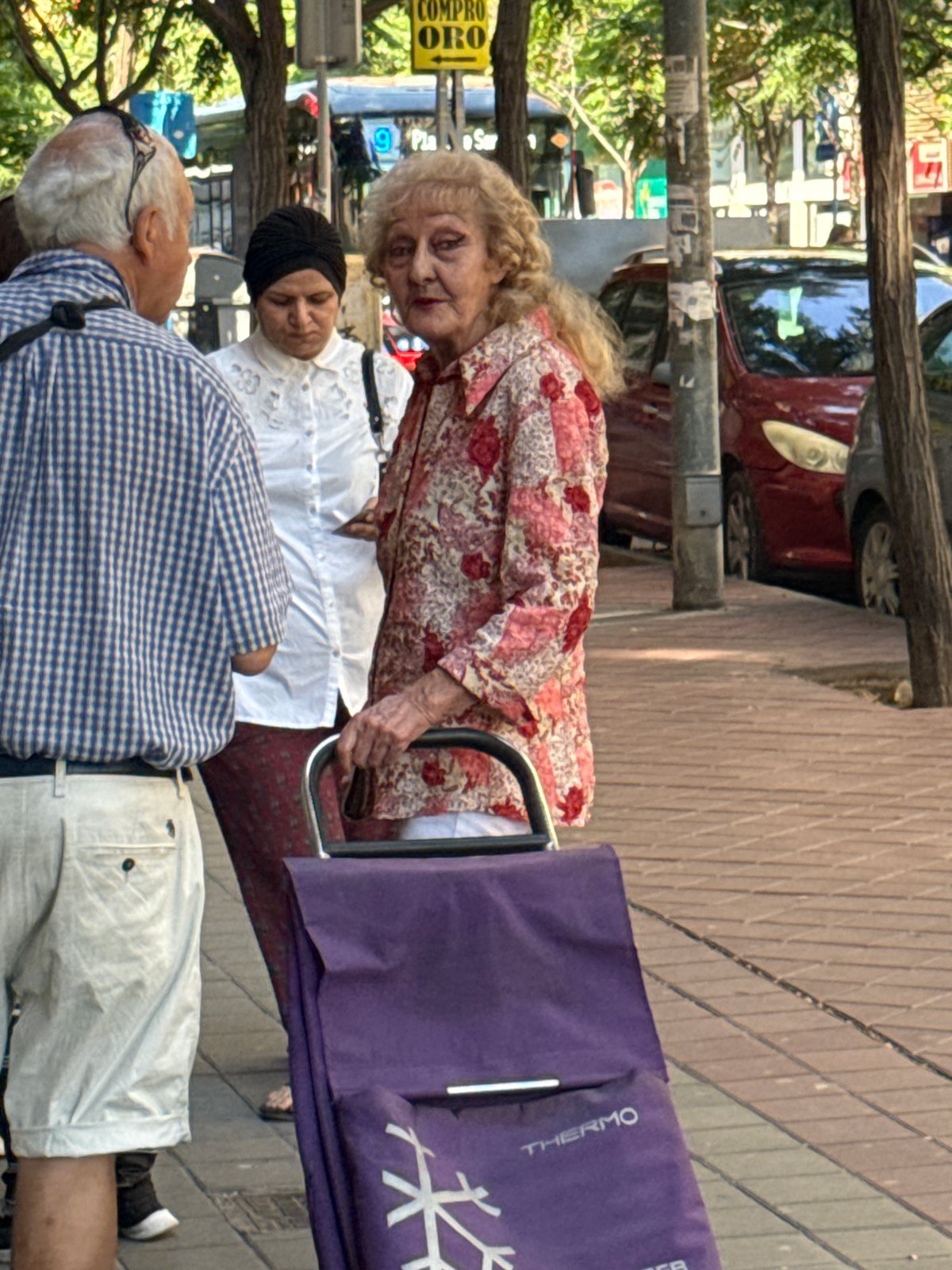 Morning market scenes with elderly shoppers and vendors documented