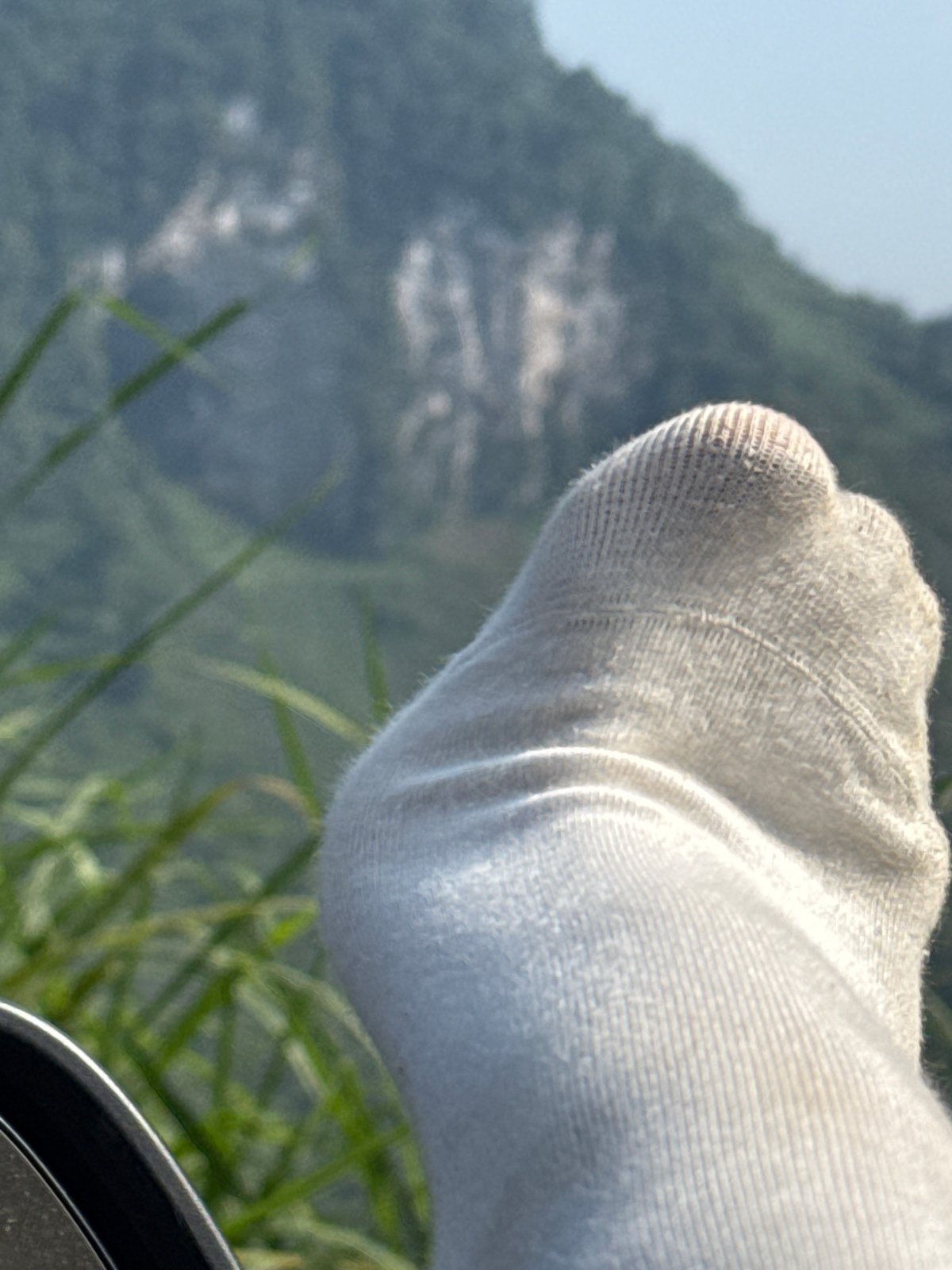 Traveler documents scenic mountain landscape in northern Vietnam commune