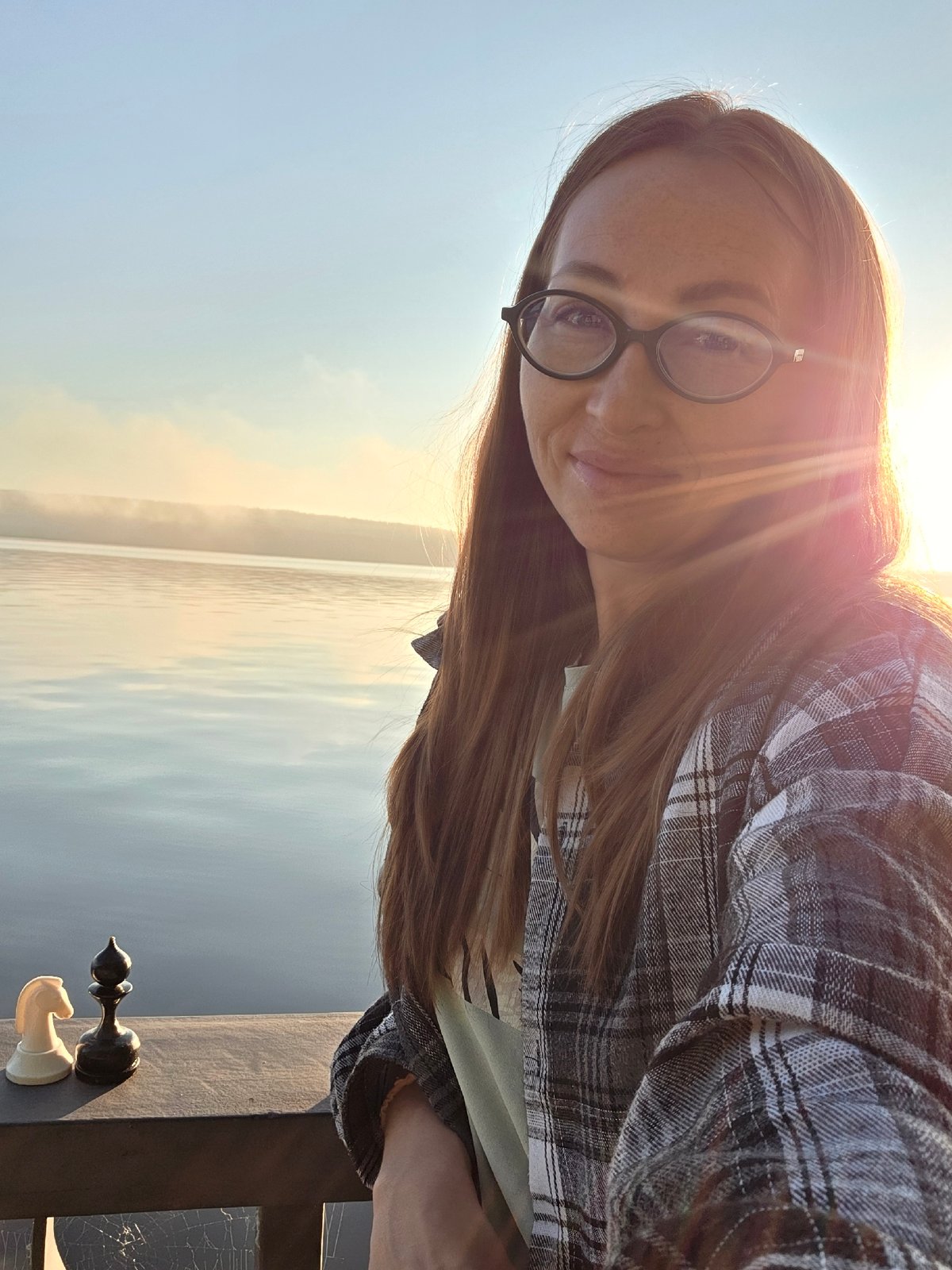 Checkers game at a Chaikovsky waterfront on a sunny day