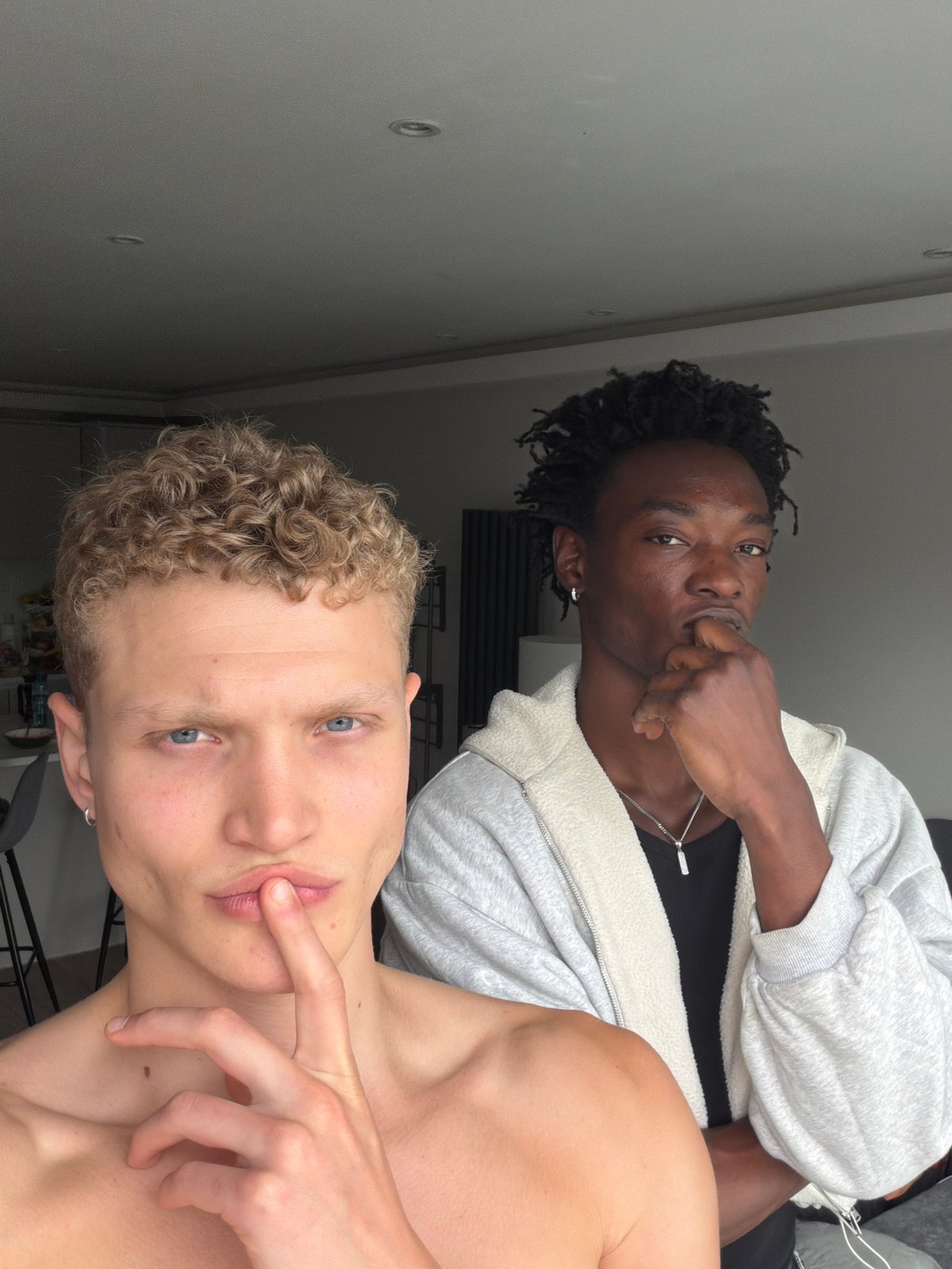 Two young men photographed in London apartment