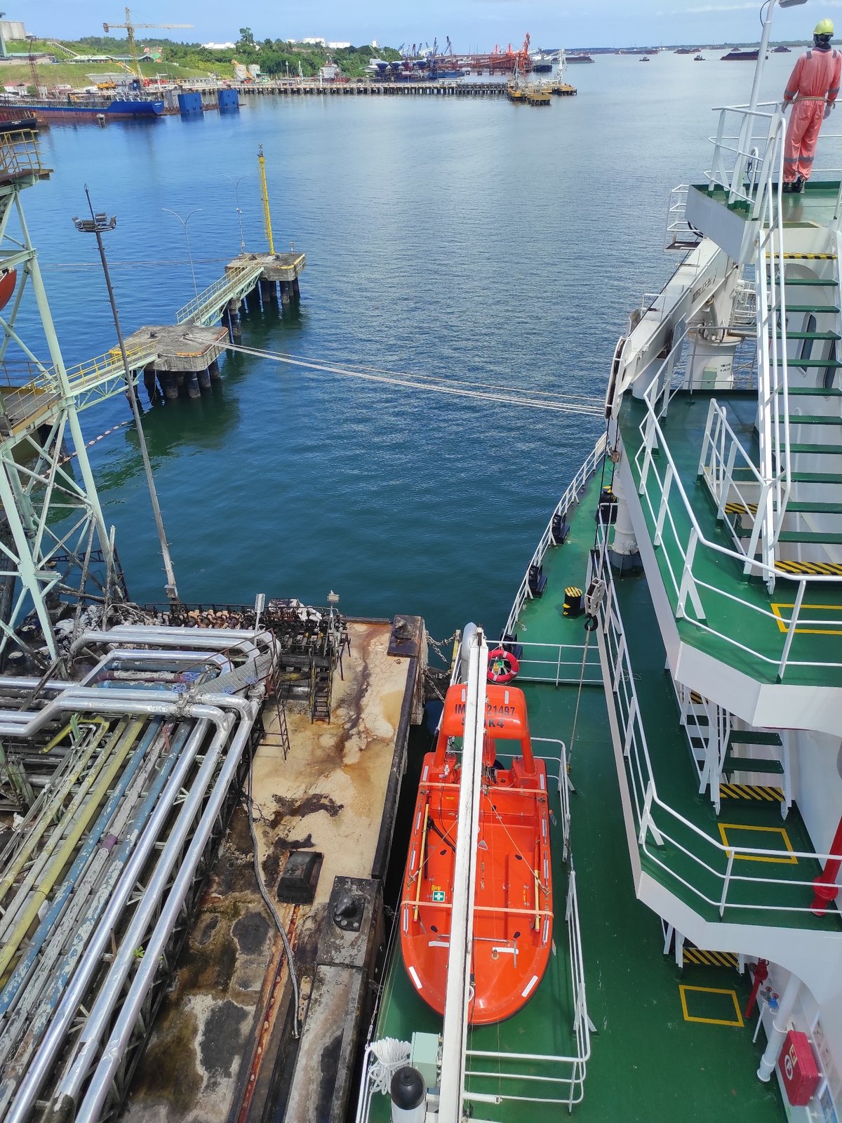 Industrial port operations with docked cargo ship
