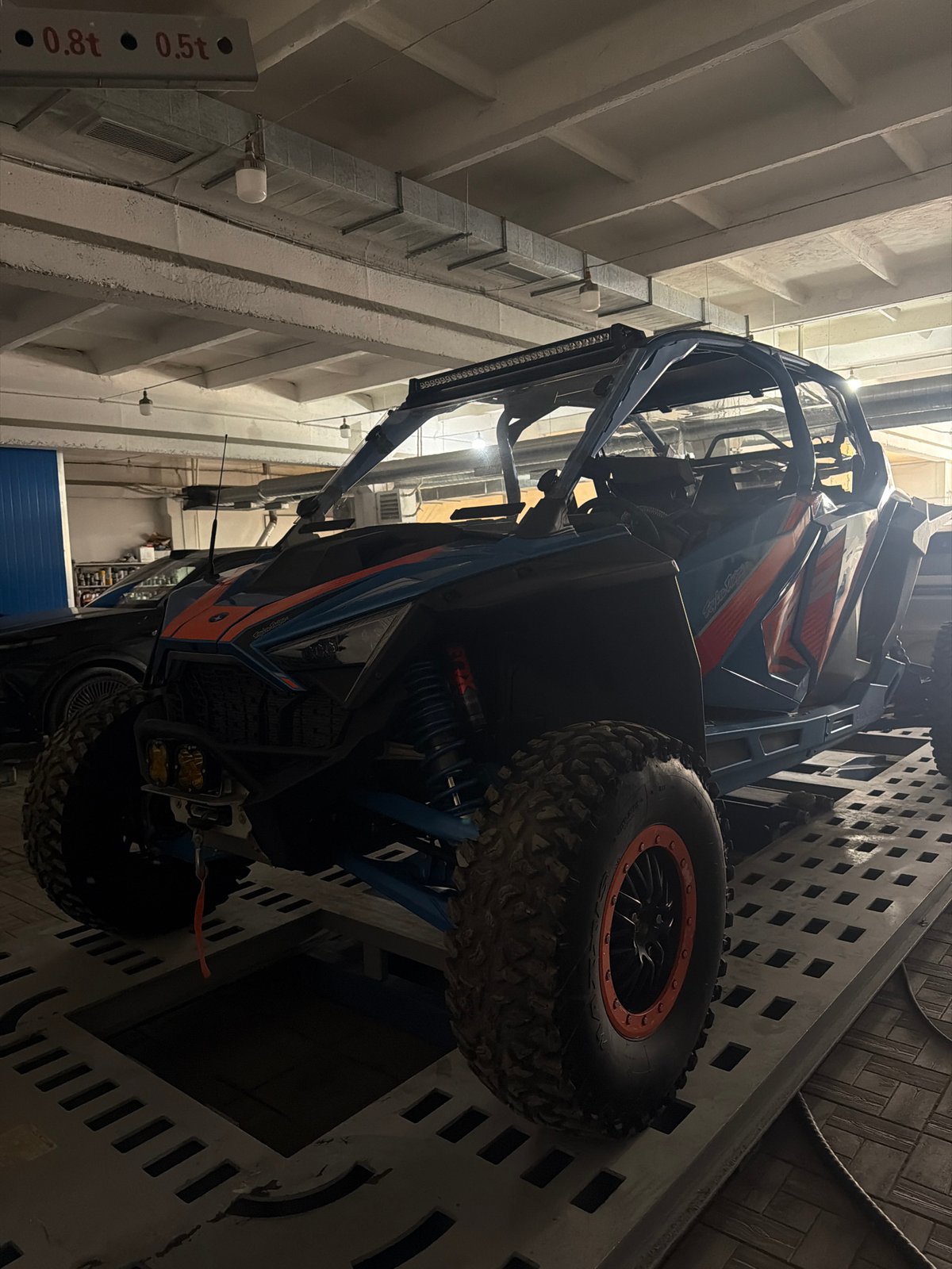 ATV and motorcycle spotted parked at indoor facility