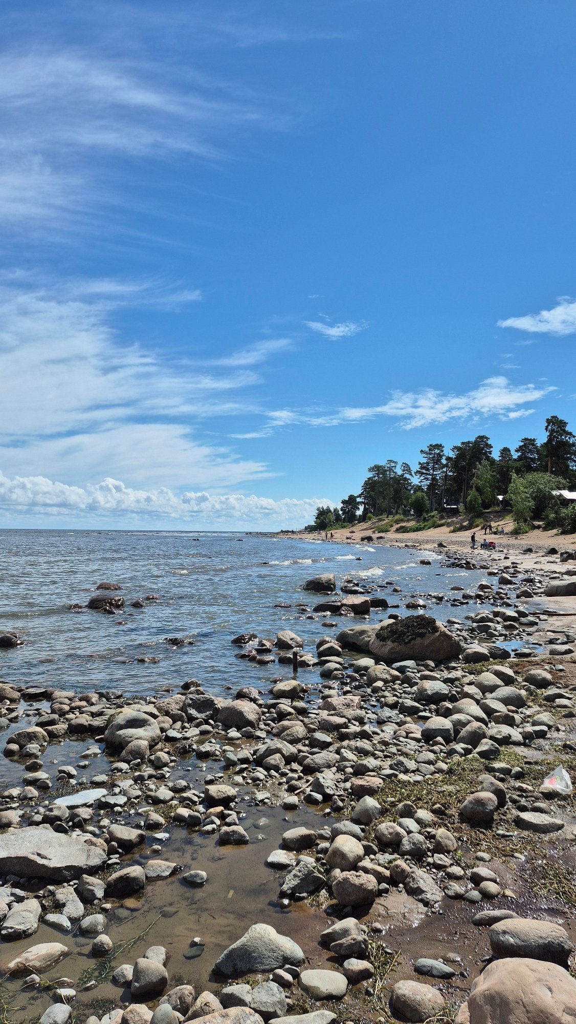 Rocky shoreline explored from multiple angles on a cloudy day