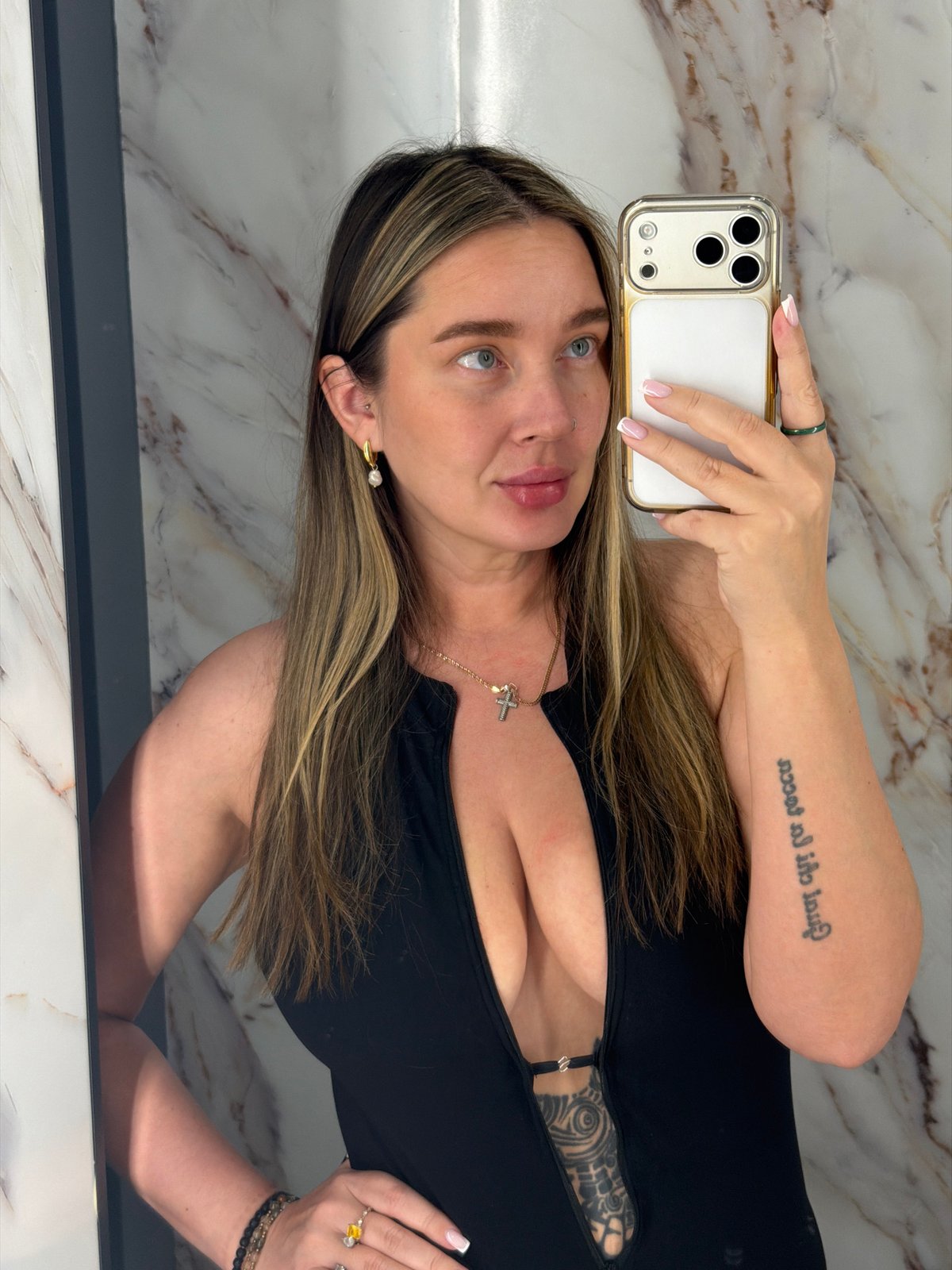 Woman Takes Selfies in Moscow Bathroom Setting