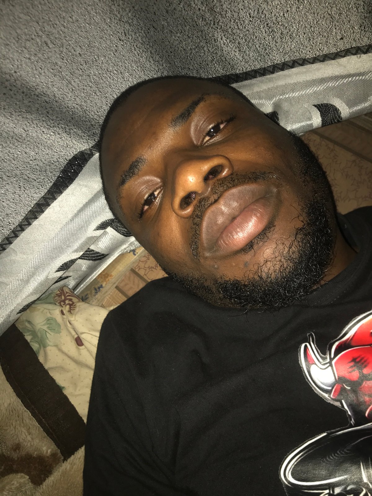 Man photographed lying indoors by multiple witnesses