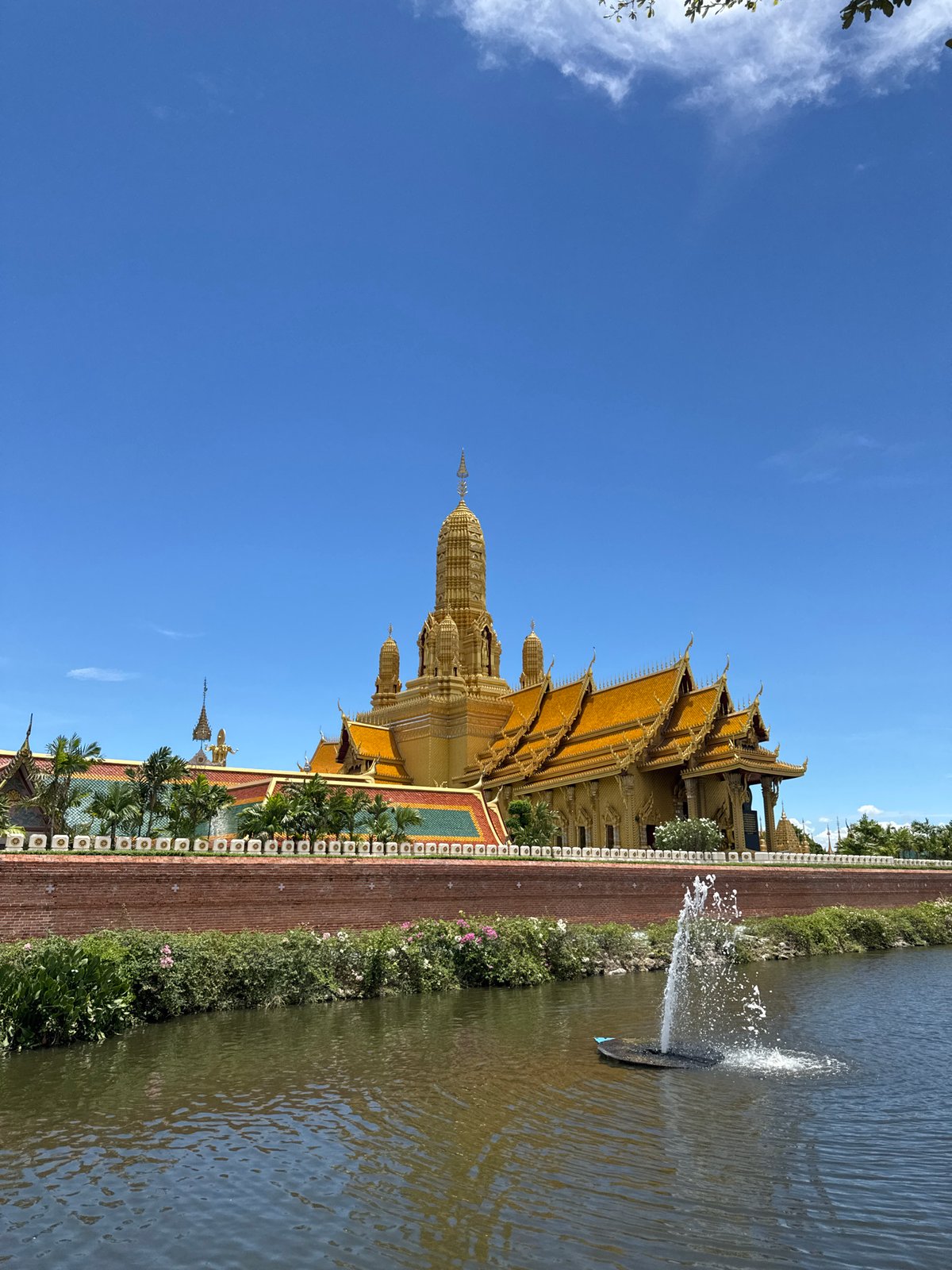 Golden Buddhist temple complex documented in Bang Pu, Thailand