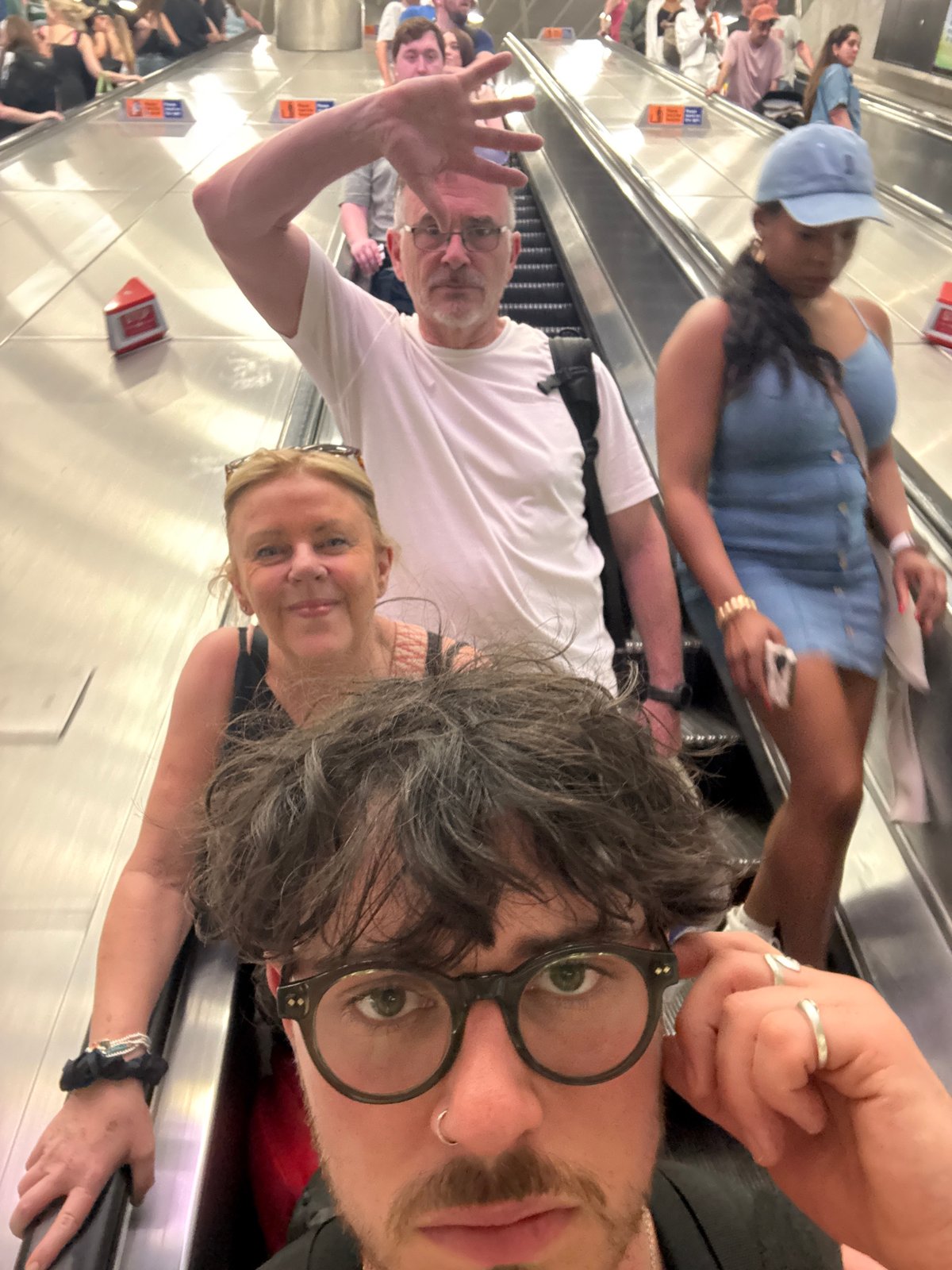 Man travels through London Underground stations during afternoon commute