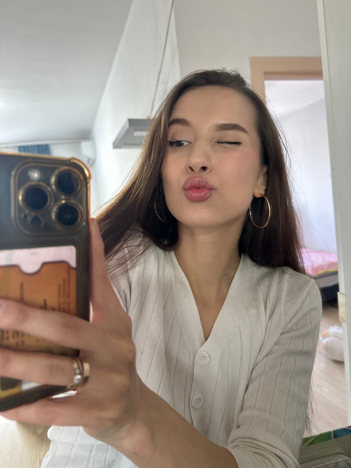 Woman takes playful mirror selfies in Yekaterinburg apartment