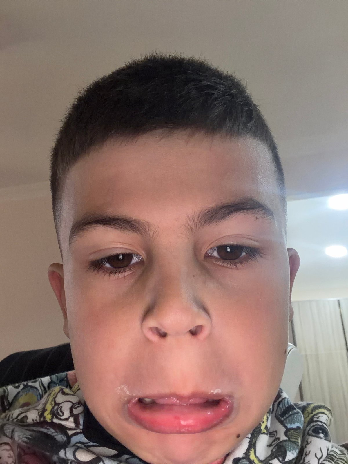 Child films playful self-portrait on phone in Yerevan