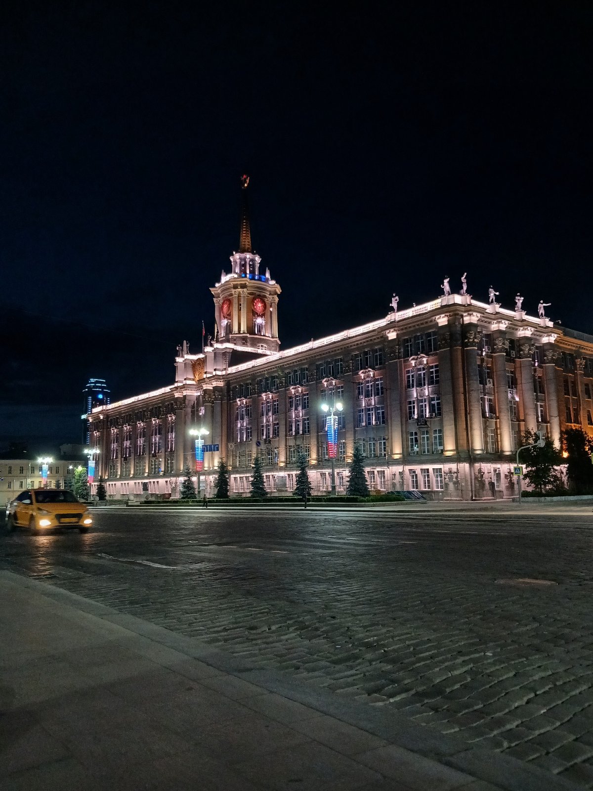 Nighttime views of illuminated Yekaterinburg government buildings documented