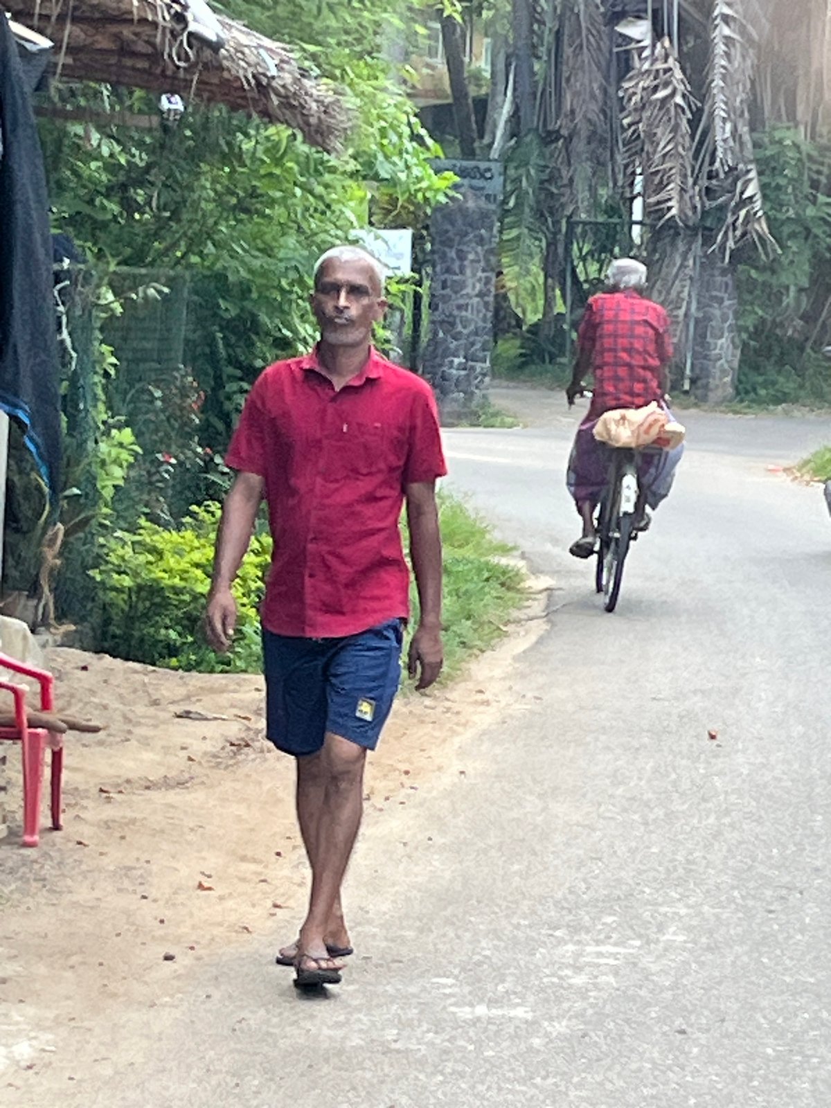 Morning commute on foot and motorcycle in coastal Sri Lanka