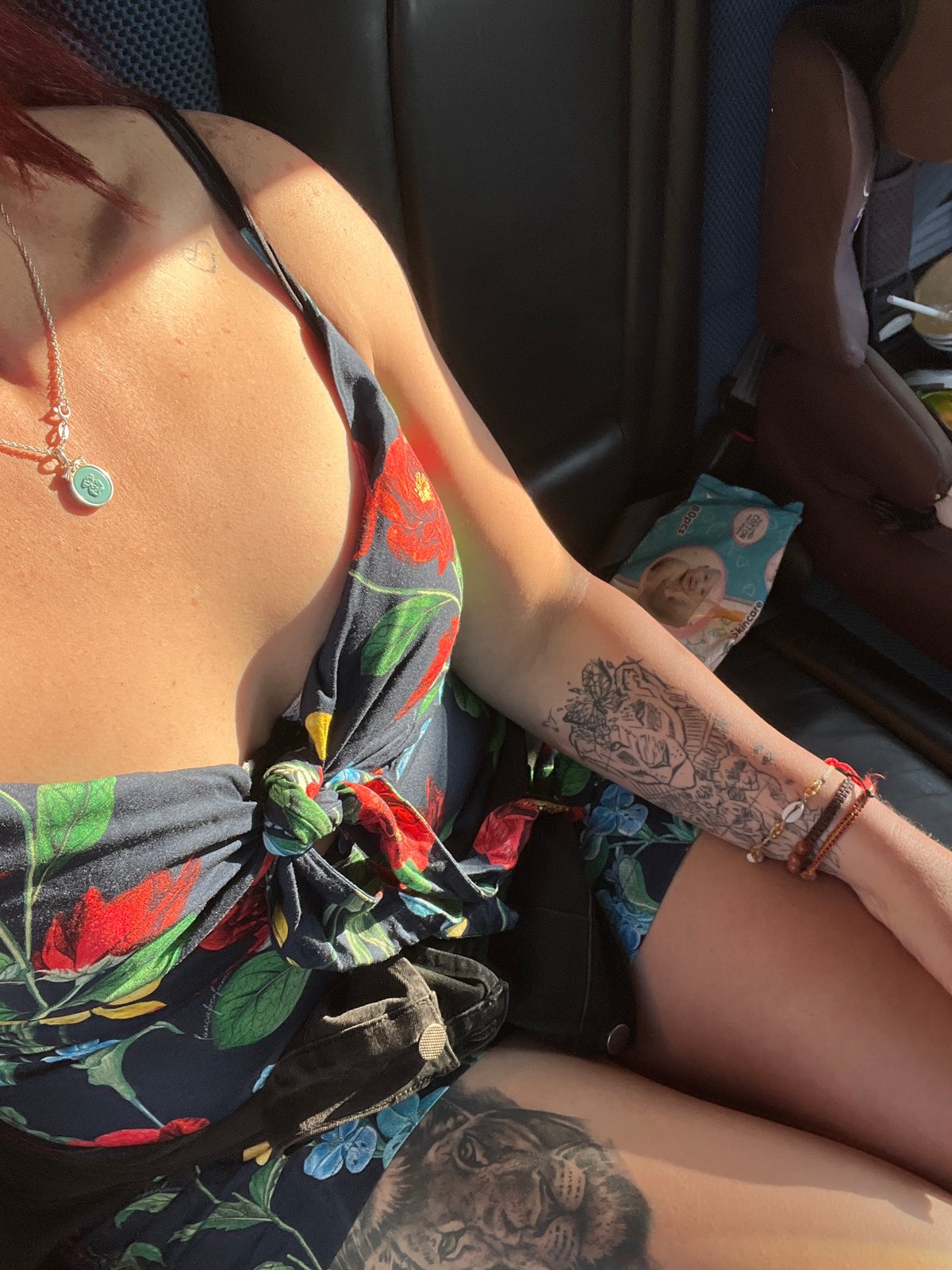 Woman in floral dress observed in vehicle, Arica Chile