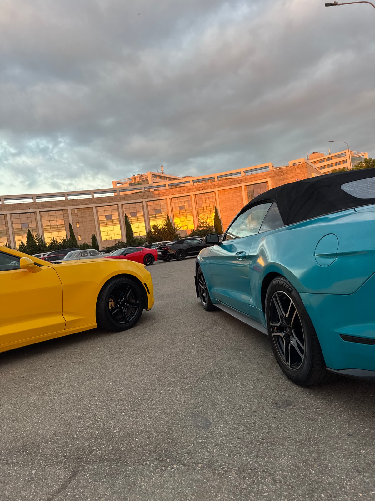 Sunset evening at Sirius waterfront: harbor, planes, and sports cars