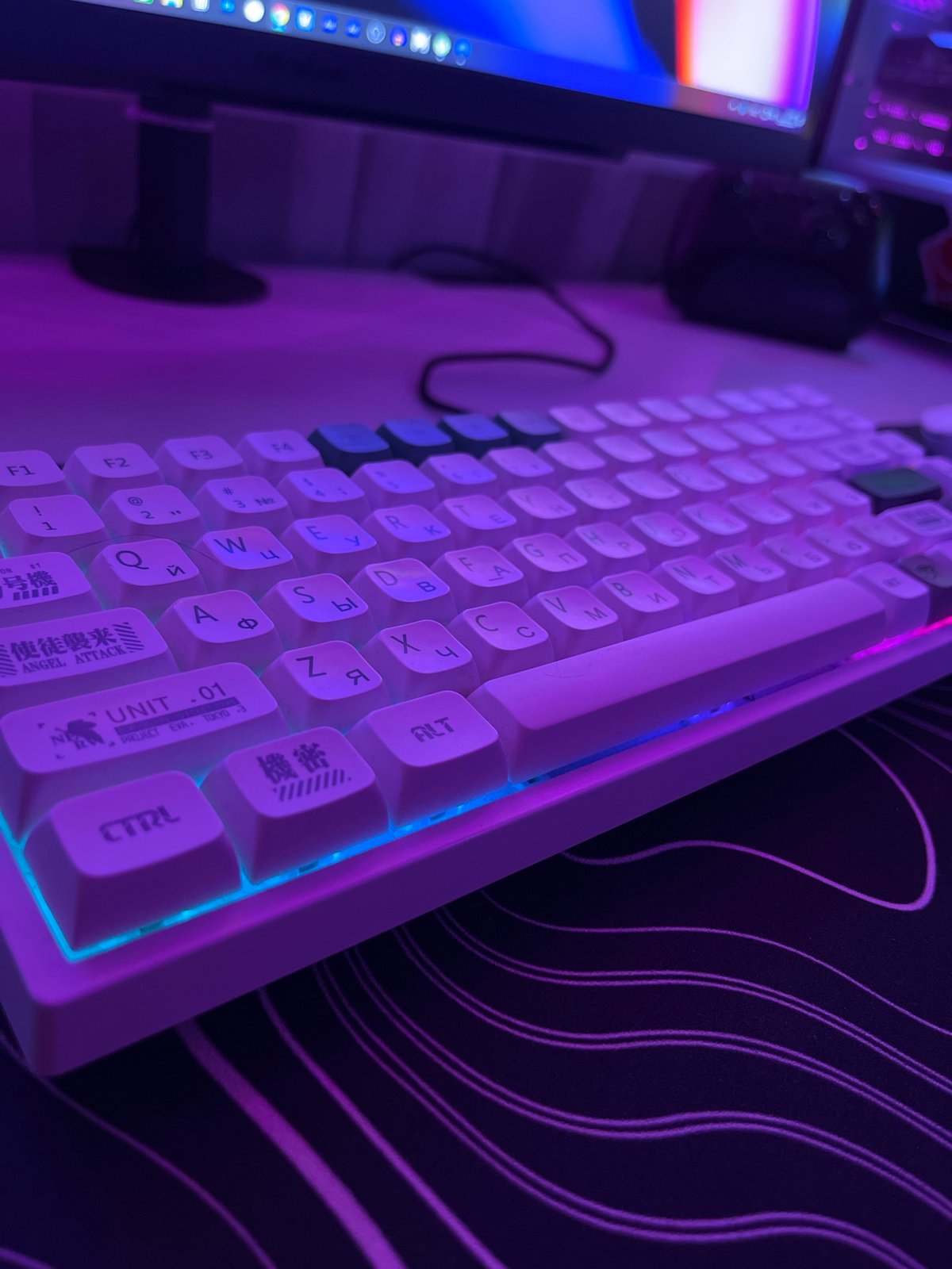 Custom mechanical keyboard with RGB lighting and mixed-script keycaps